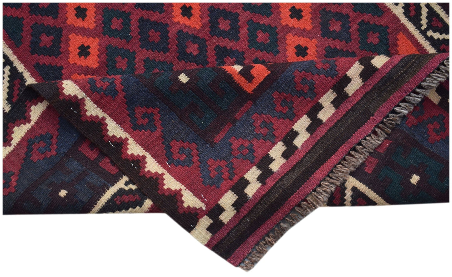 Handwoven Afghan Maimana kilim runner featuring a geometric pattern in red, blue, and cream.