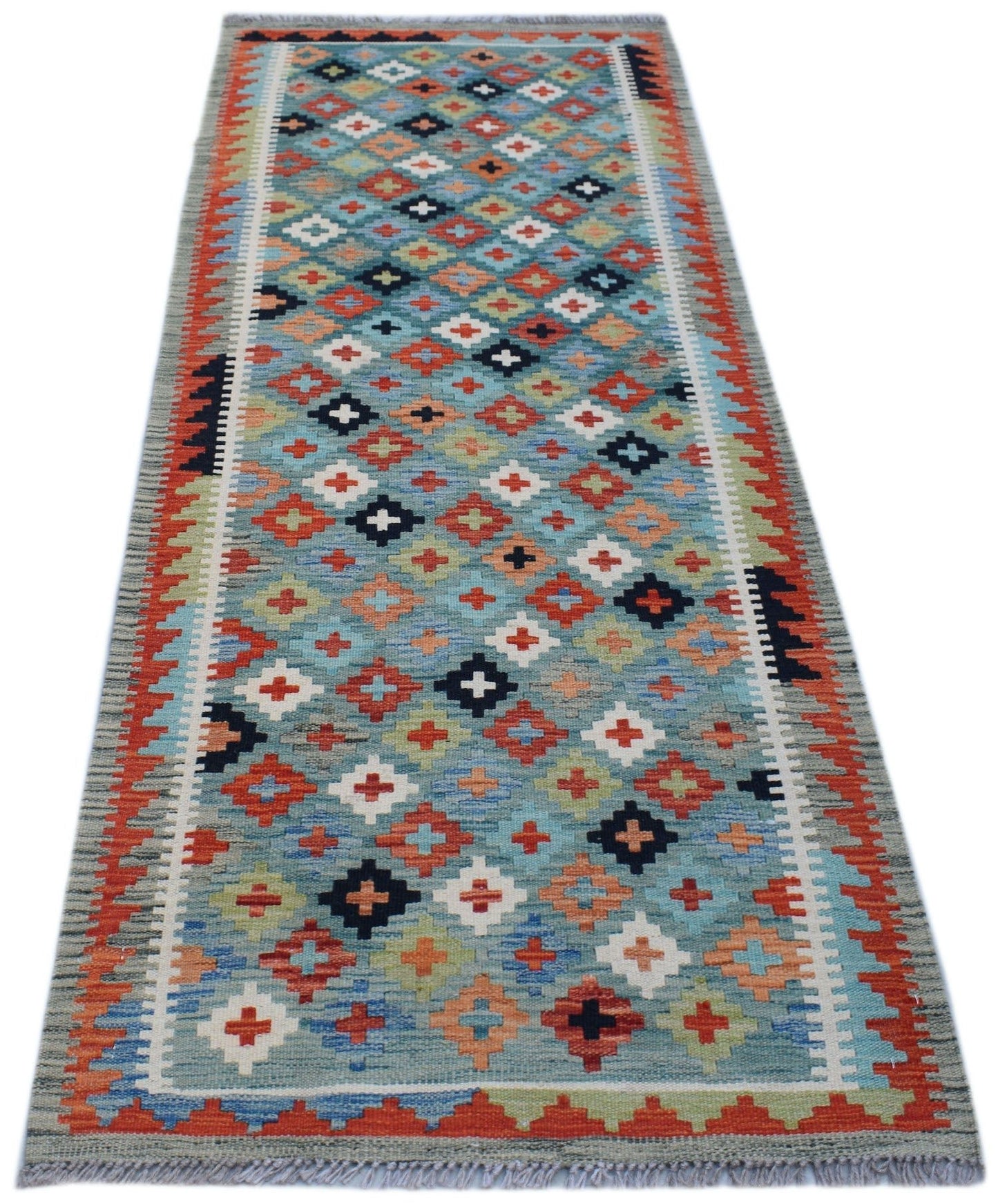 Handmade Afghan Maimana wool runner rug featuring a colorful geometric diamond pattern.
