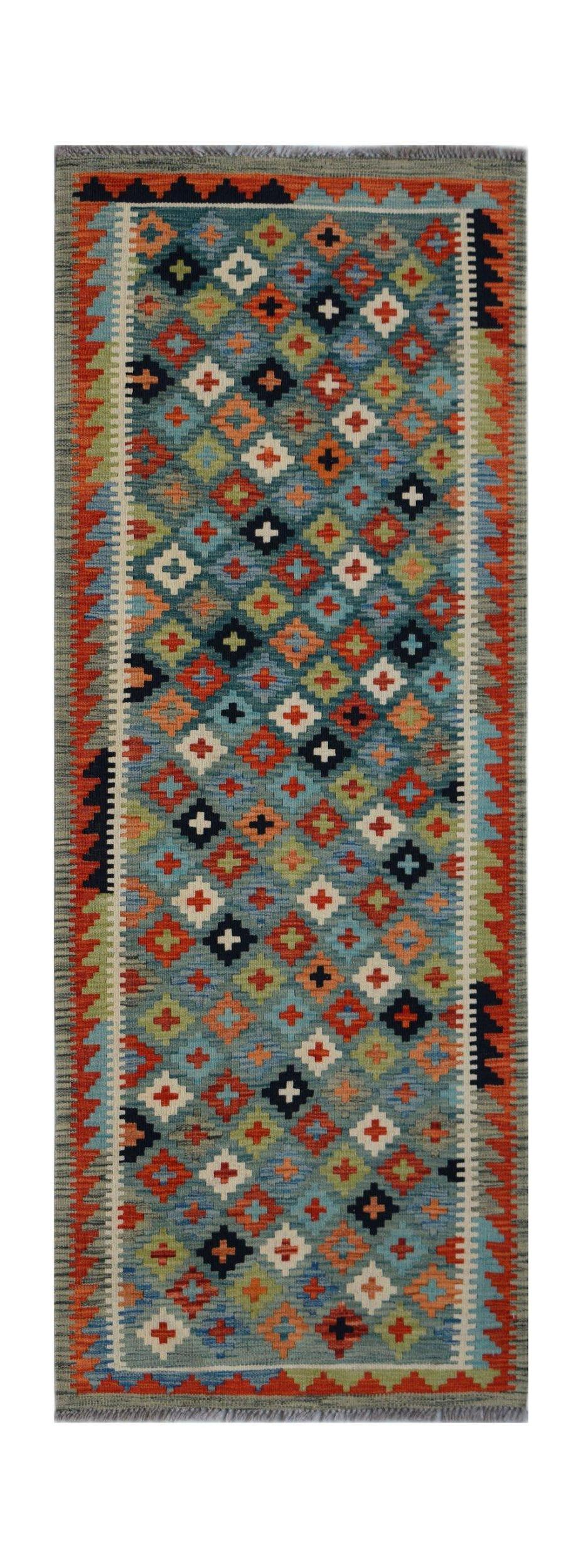 Handwoven Afghan Maimana wool runner rug featuring a colorful geometric diamond pattern.