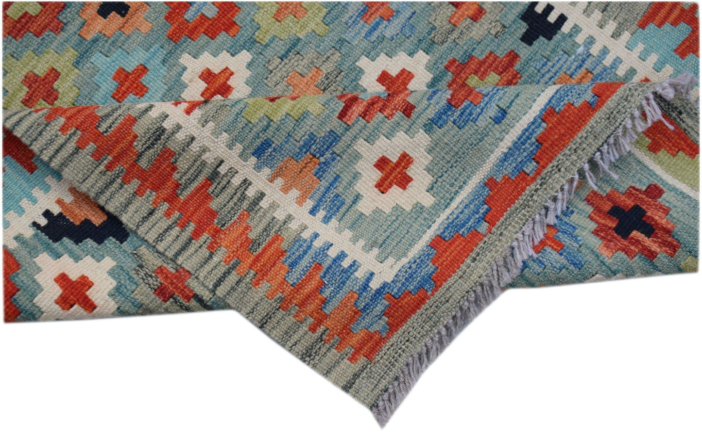 An Afghan Maimana Kilim runner featuring a geometric pattern in blue, orange, and cream wool.