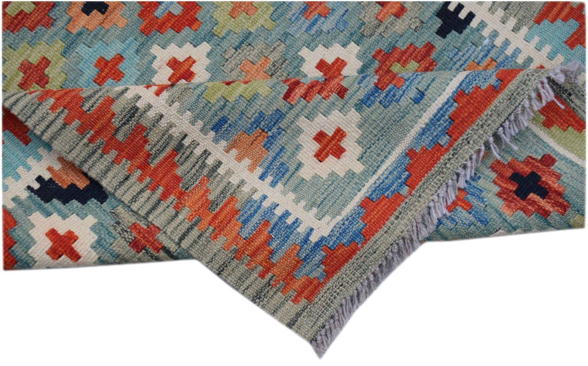 An Afghan Maimana Kilim runner featuring a geometric pattern in blue, orange, and cream wool.