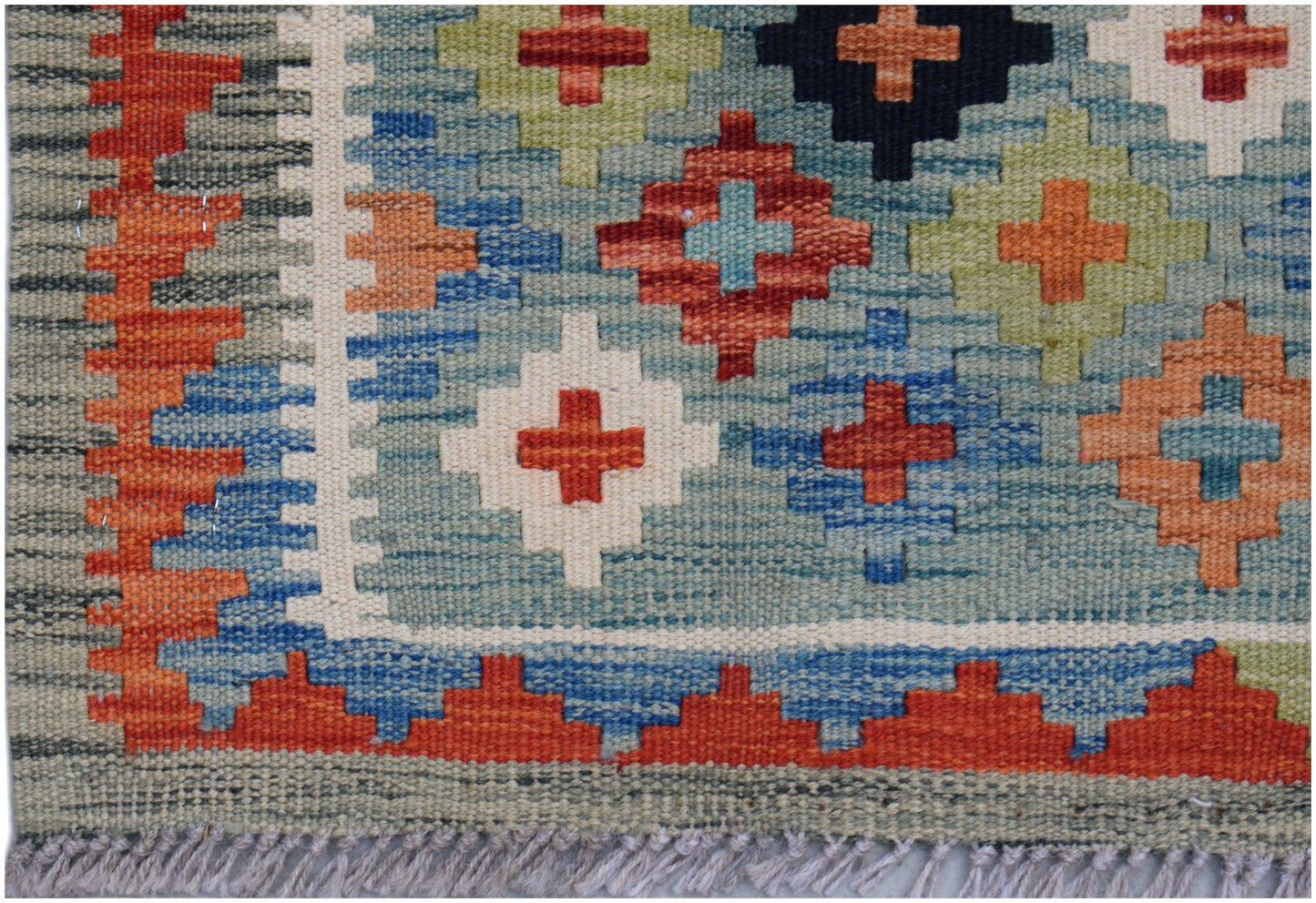 Handwoven Afghan Maimana wool runner featuring a geometric pattern in vibrant multi-colored tones.