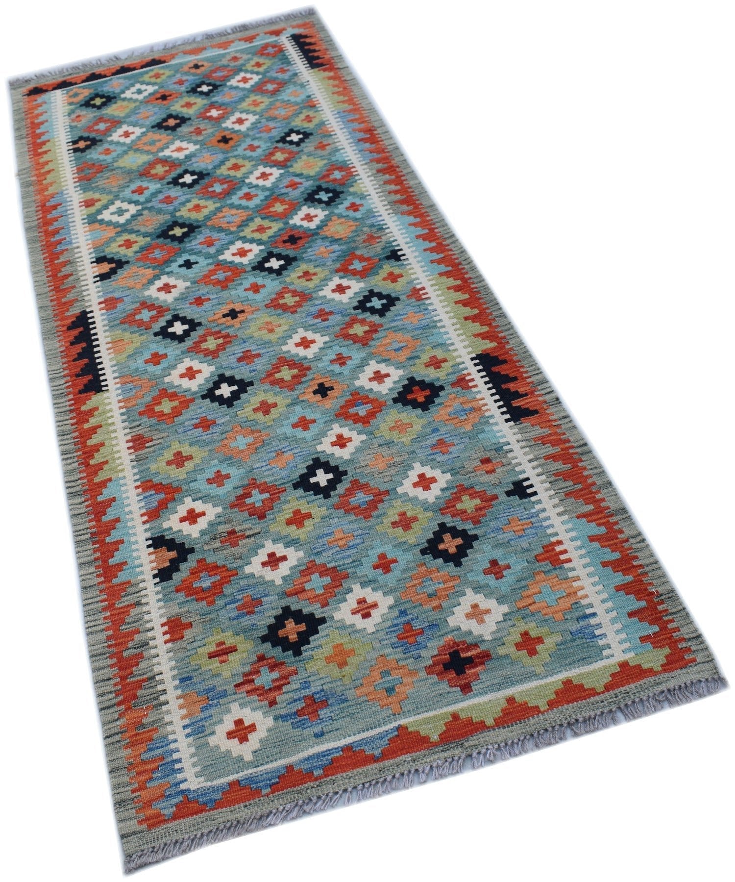 Handwoven Afghan Maimana wool runner rug featuring a colorful geometric pattern on a blue field.