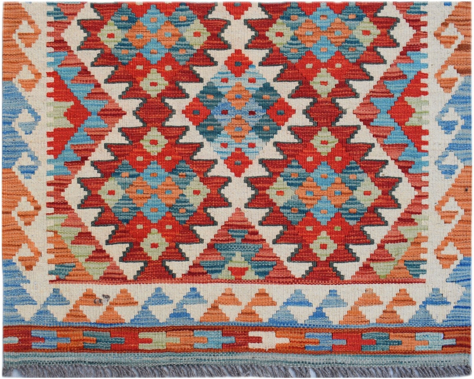 Handwoven Afghan Maimana wool kilim runner featuring a vibrant geometric pattern in multi-colored.