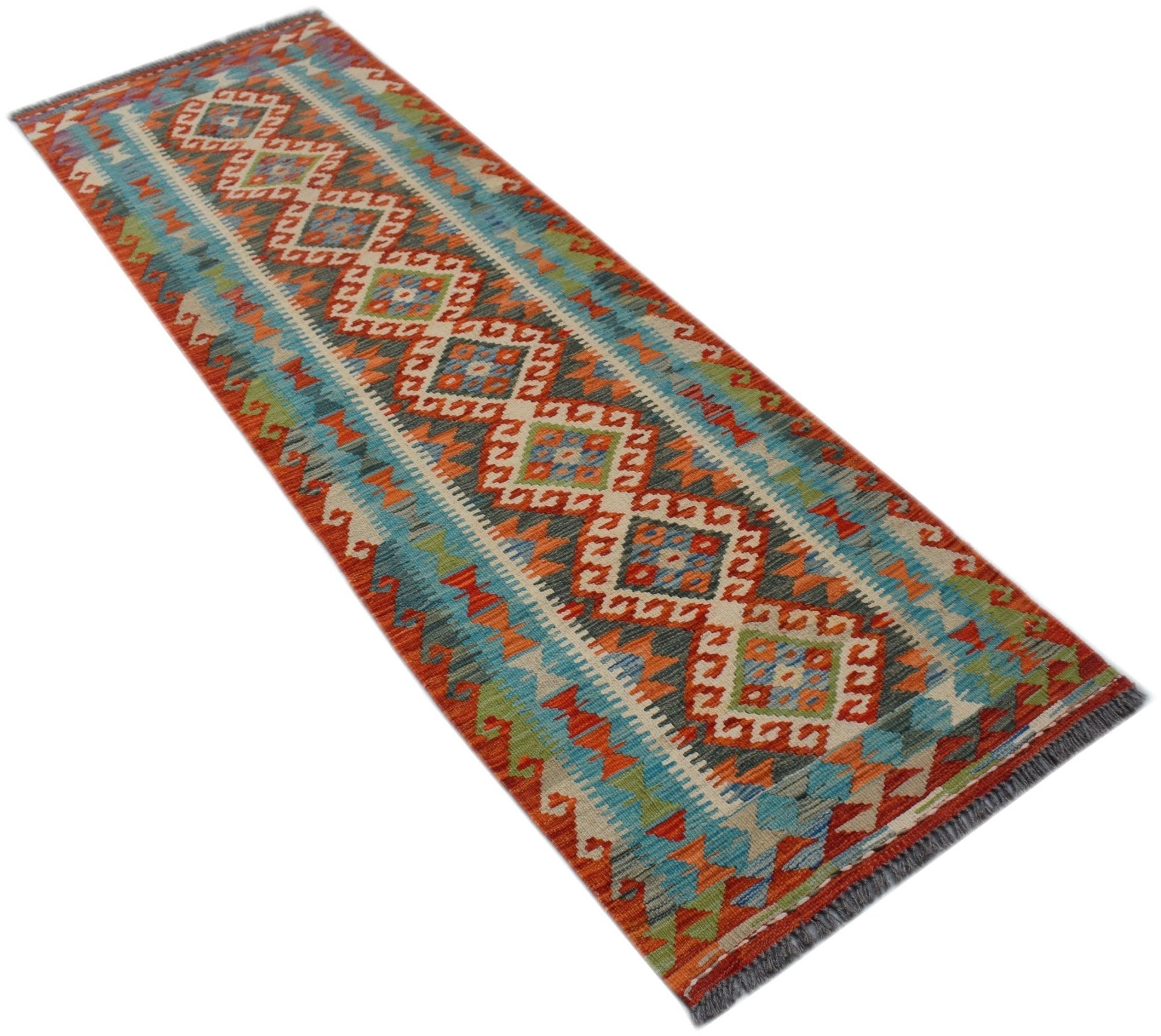 A handmade Afghan Maimana wool runner rug featuring a colorful geometric diamond pattern.