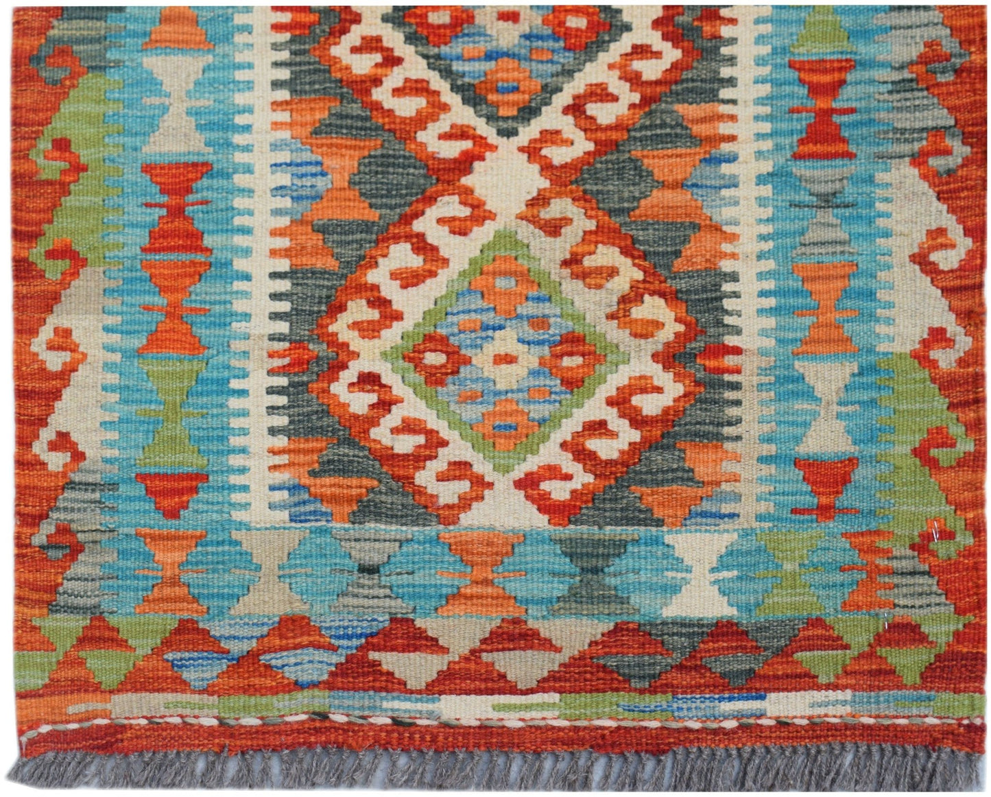 Handwoven Afghan Maimana wool runner featuring a vibrant geometric pattern in multi-colored hues.