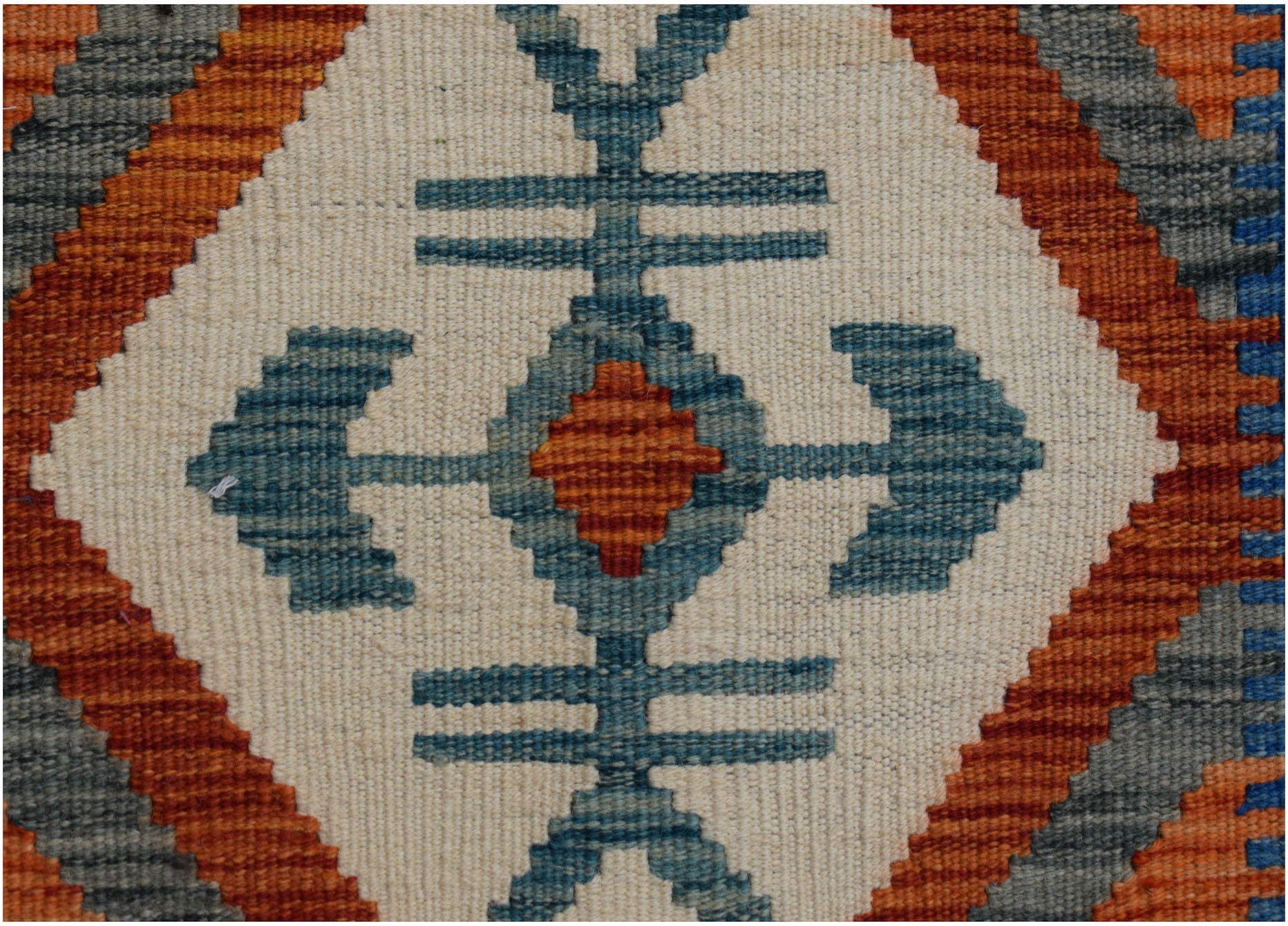 Handwoven Afghan Maimana kilim runner featuring a geometric blue and orange diamond pattern.
