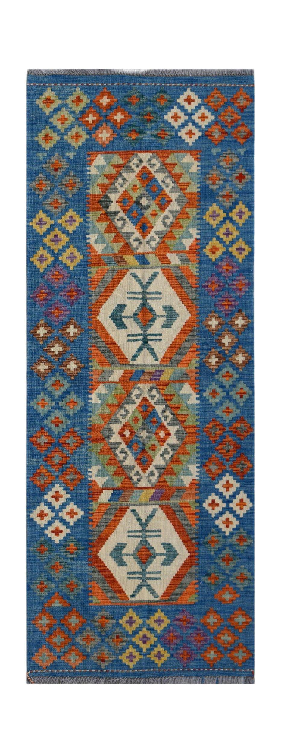Handwoven Afghan Maimana wool runner featuring a blue background with geometric tribal patterns.