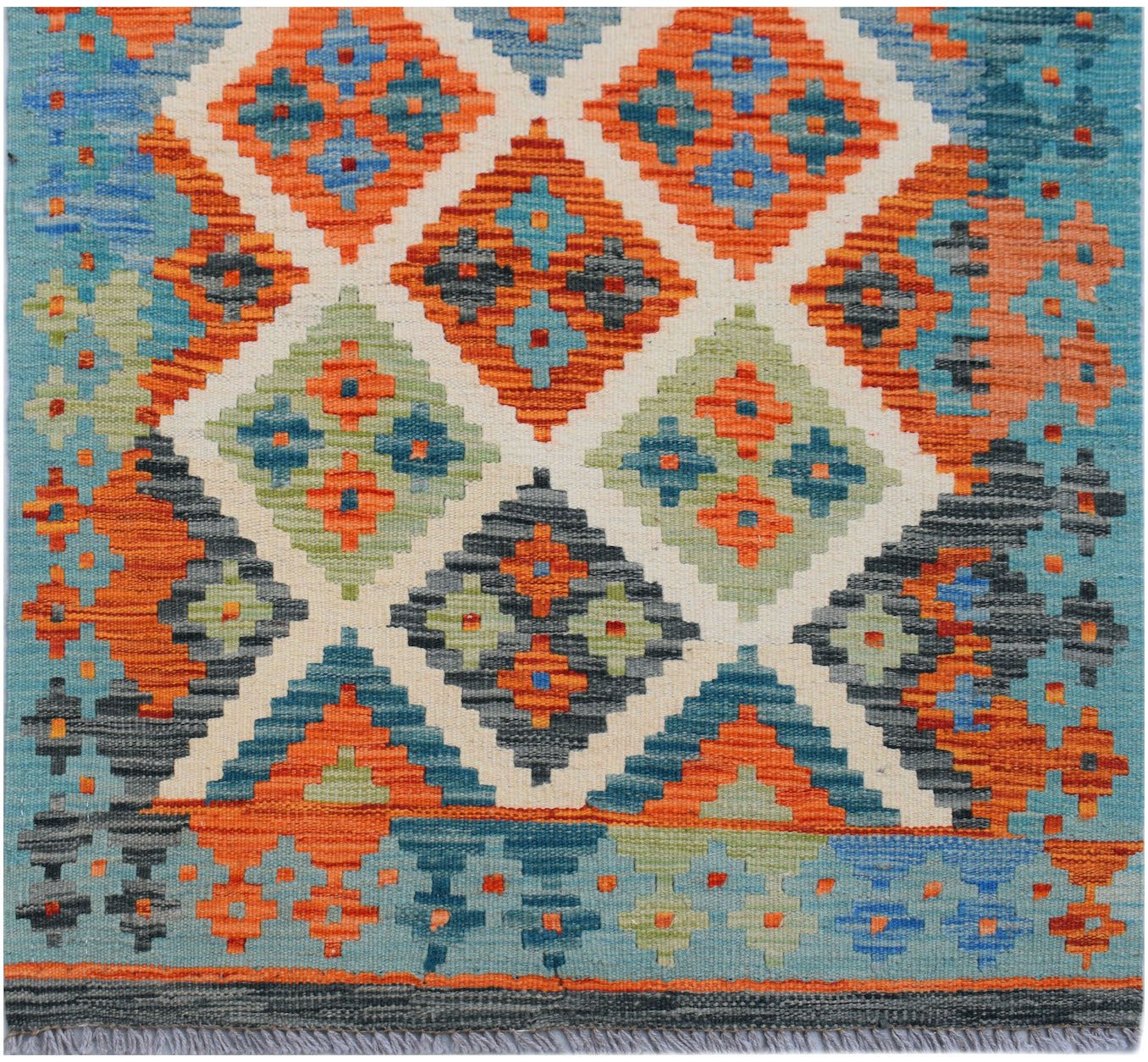Handwoven Afghan Maimana kilim runner featuring a geometric diamond pattern in vibrant colors.