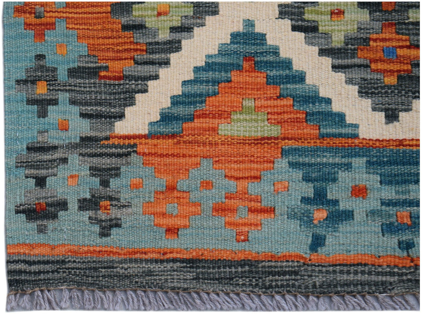 Handwoven Afghan Maimana wool kilim runner featuring a geometric pattern in orange and blue.
