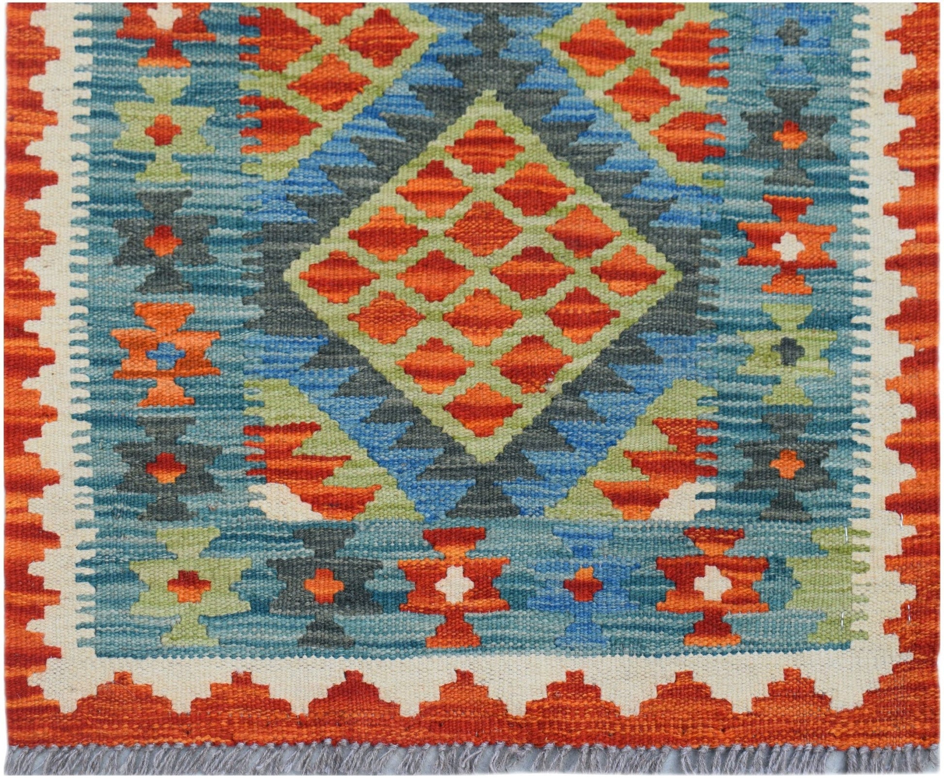 Handwoven Afghan Maimana wool runner featuring a geometric diamond pattern in orange and blue.