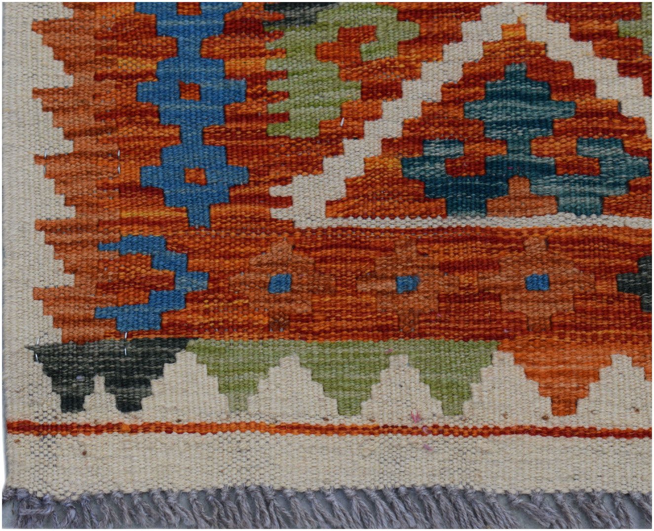 Handwoven Afghan Maimana wool kilim runner featuring geometric patterns in orange, blue, and green.
