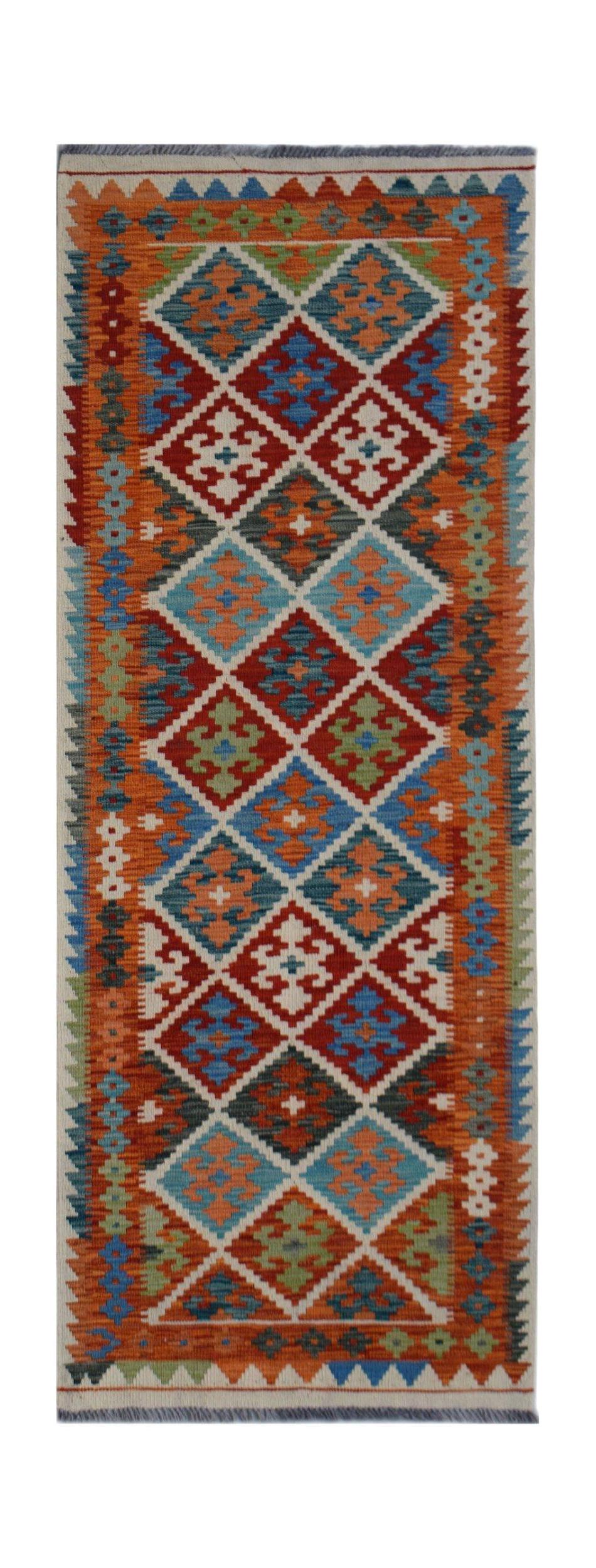 Handwoven Afghan Maimana wool runner rug featuring a colorful geometric diamond pattern.