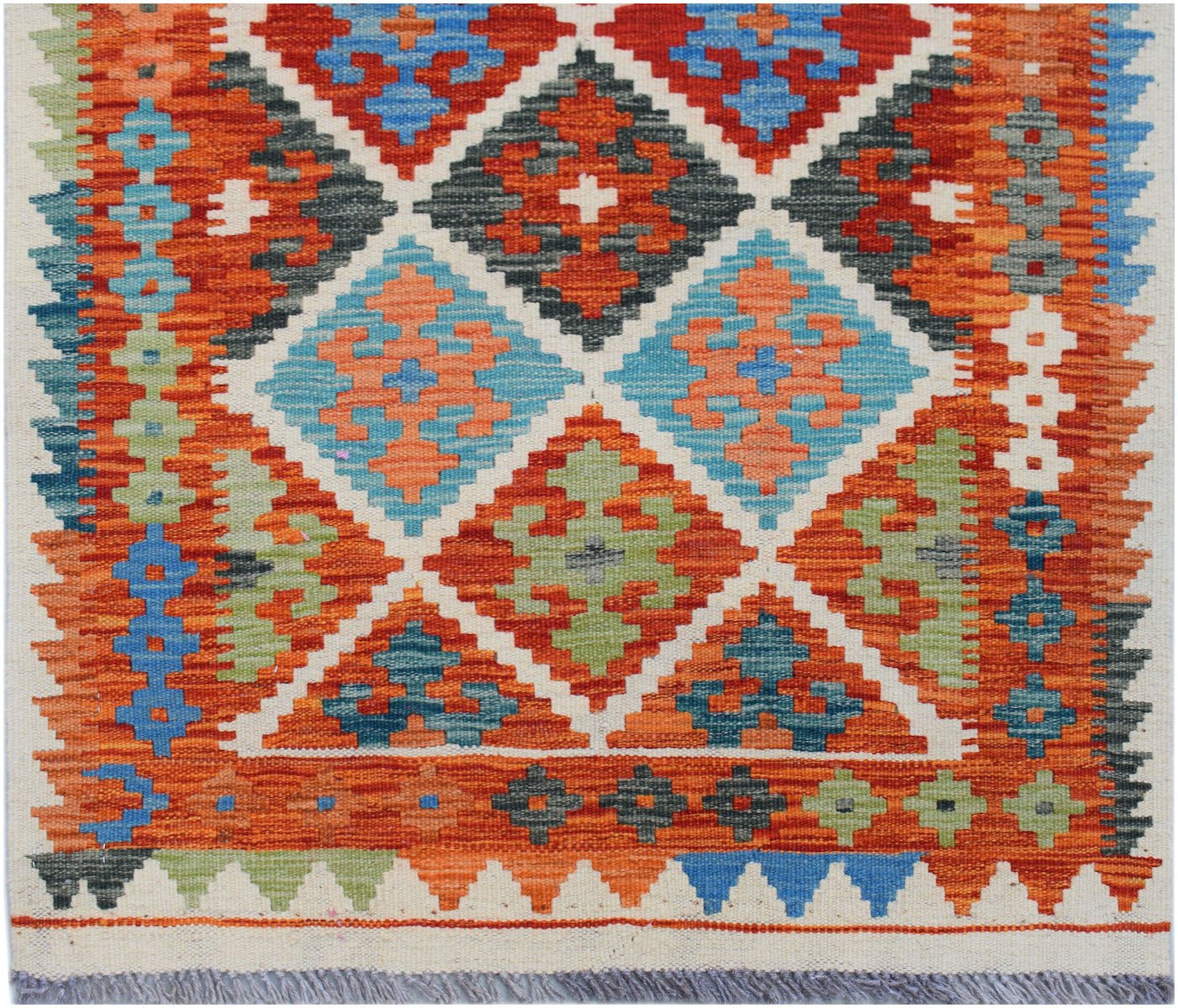 Handwoven Afghan Maimana wool runner featuring a vibrant geometric diamond pattern.