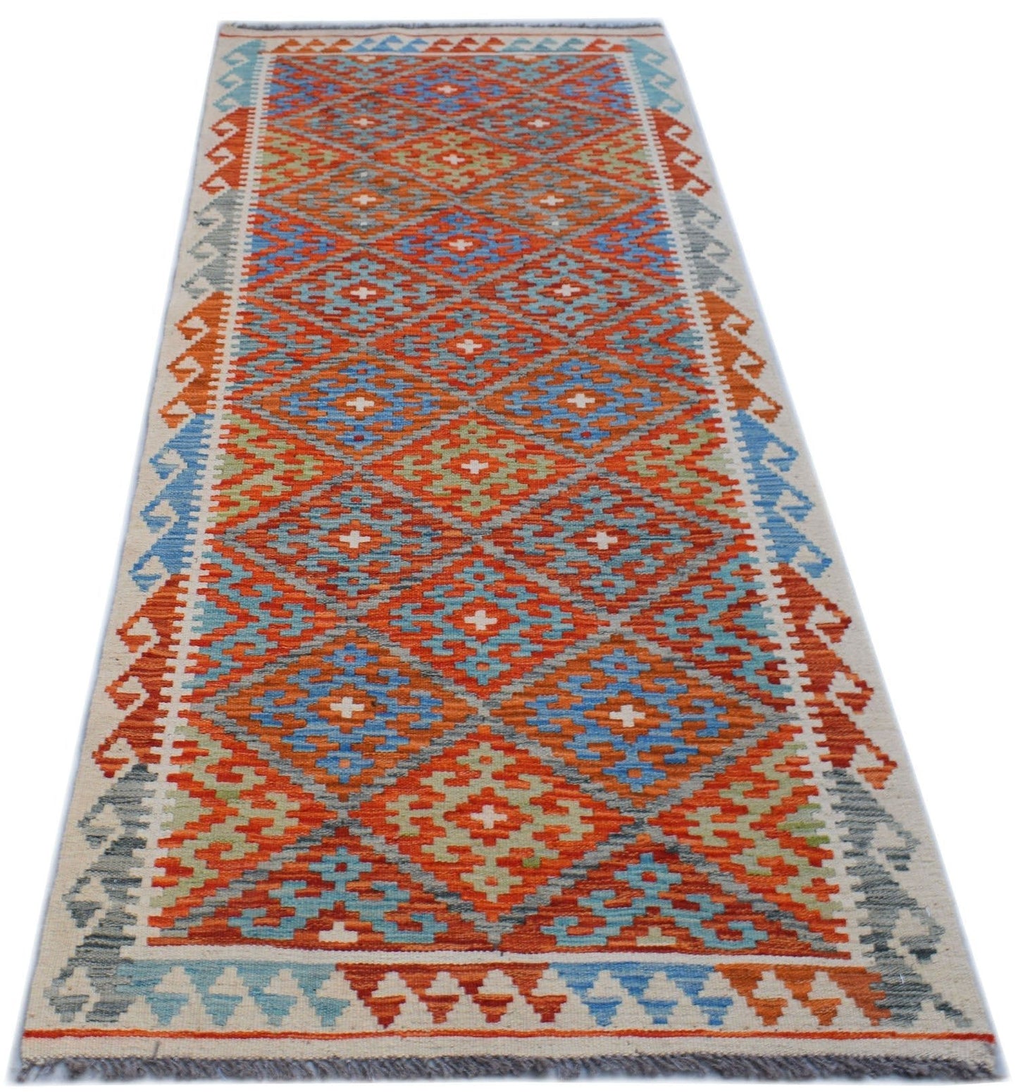 Handwoven Afghan Maimana wool runner rug featuring a colorful geometric diamond pattern.
