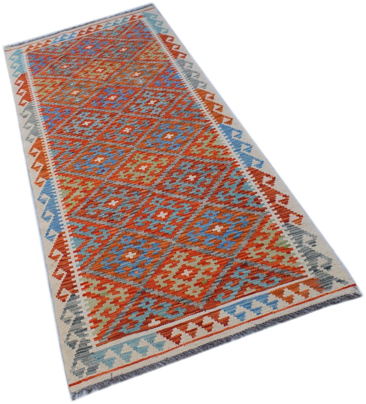 Handwoven Afghan Maimana wool runner featuring a vibrant geometric diamond pattern.