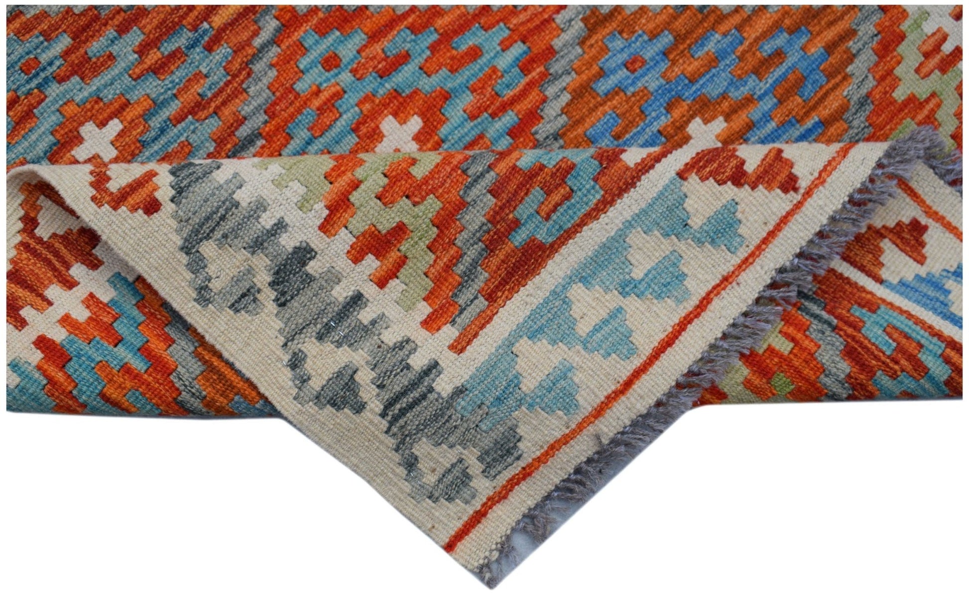Handwoven Afghan Maimana wool runner featuring a geometric pattern in orange, blue, and grey.