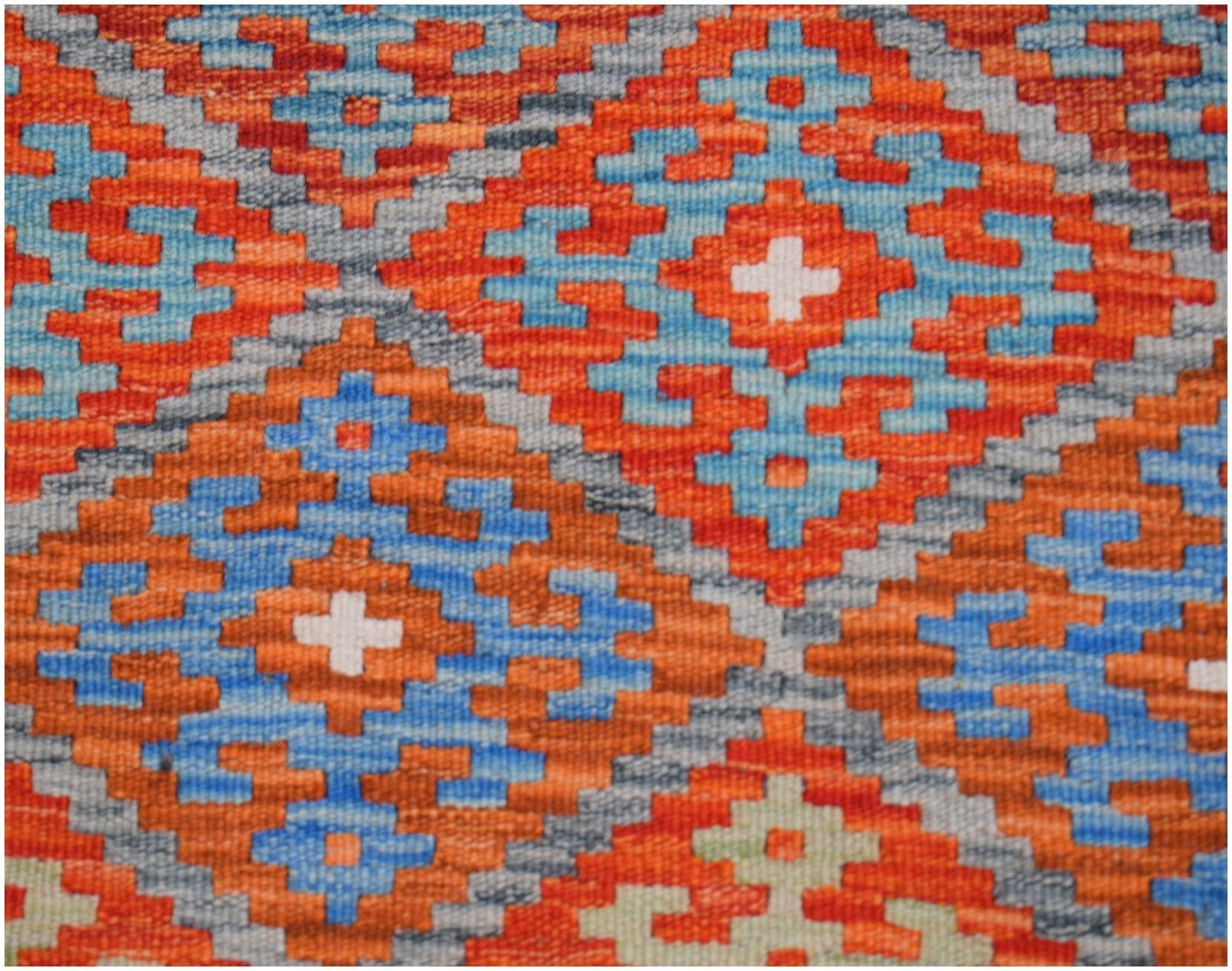 Handwoven Afghan Maimana kilim runner featuring a geometric diamond pattern in orange and blue.