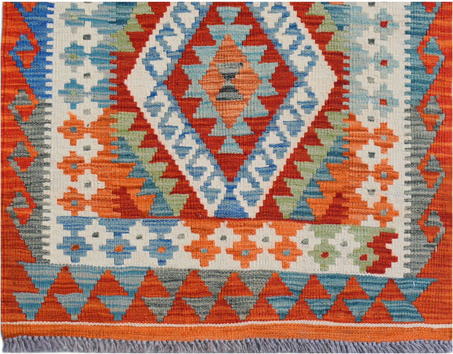 Handwoven Afghan Maimana kilim runner featuring a geometric diamond pattern in vibrant colors.