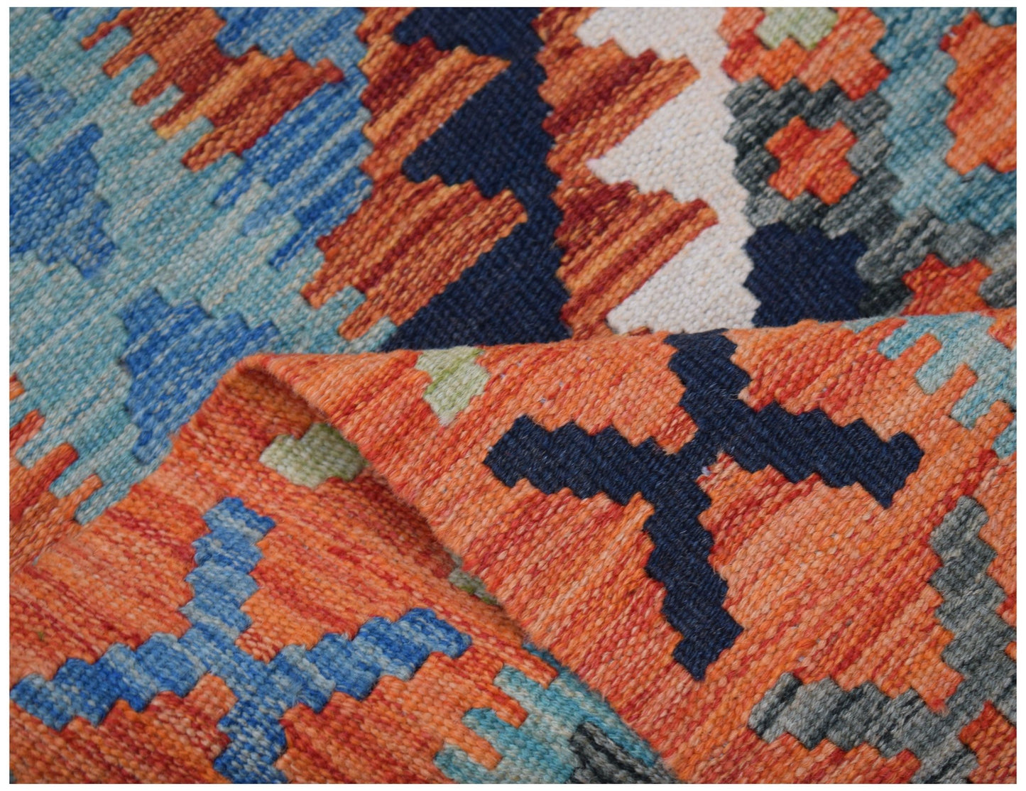 A handwoven Afghan Maimana kilim runner featuring a vibrant geometric pattern in wool.