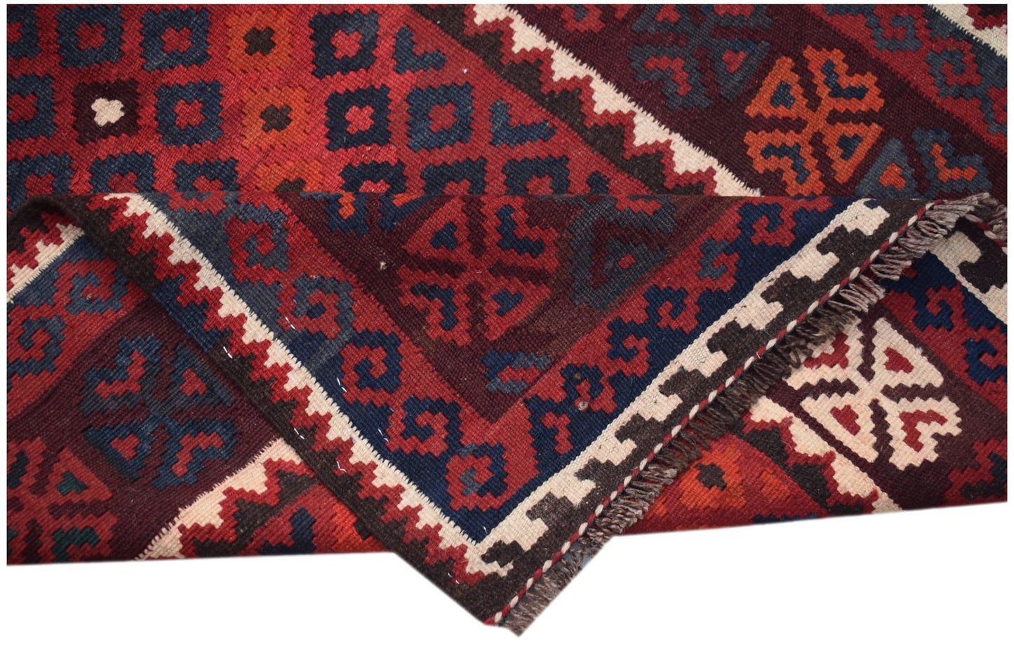 Handwoven Afghan Maimana kilim runner featuring geometric patterns in red, blue, and cream wool.