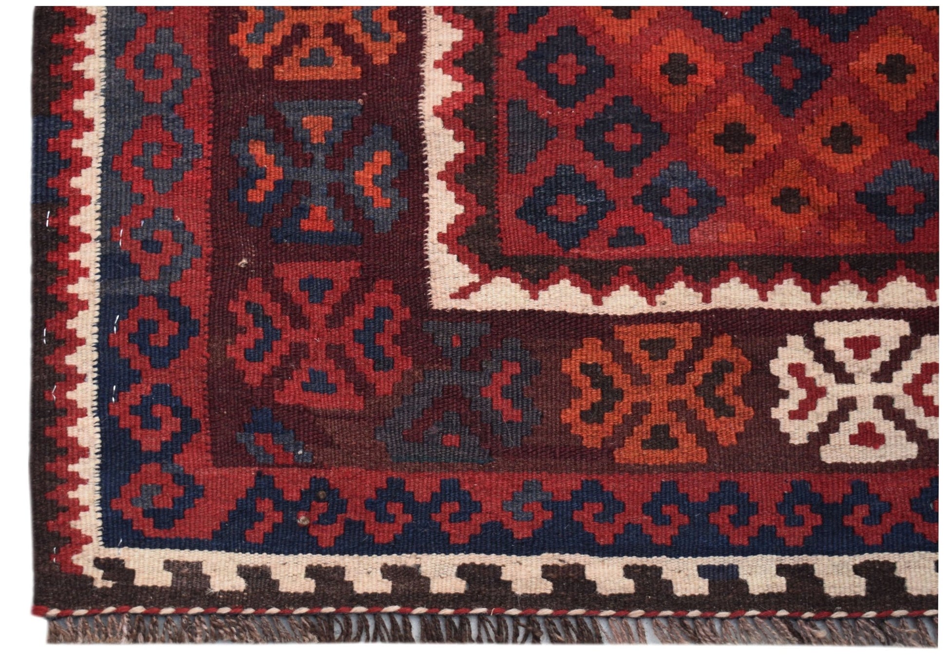 Handwoven Afghan Maimana kilim runner featuring geometric patterns in red, blue, and cream wool.