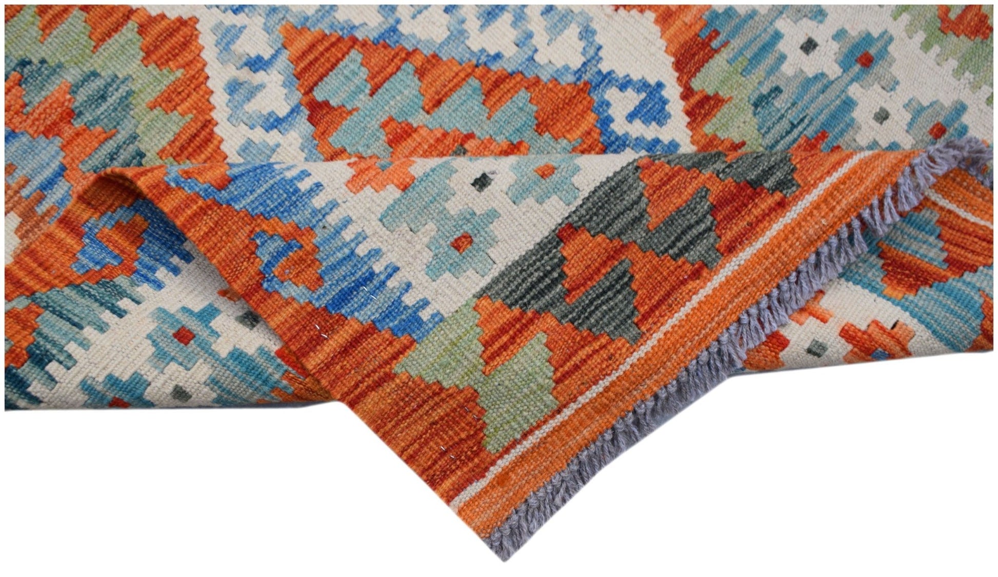 A handwoven Afghan Maimana kilim runner featuring a geometric pattern in orange, blue, and green.