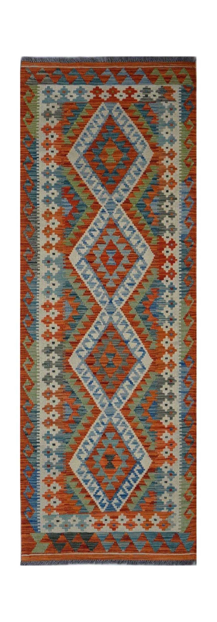 Handwoven Afghan Maimana wool runner rug featuring a vibrant geometric diamond pattern.