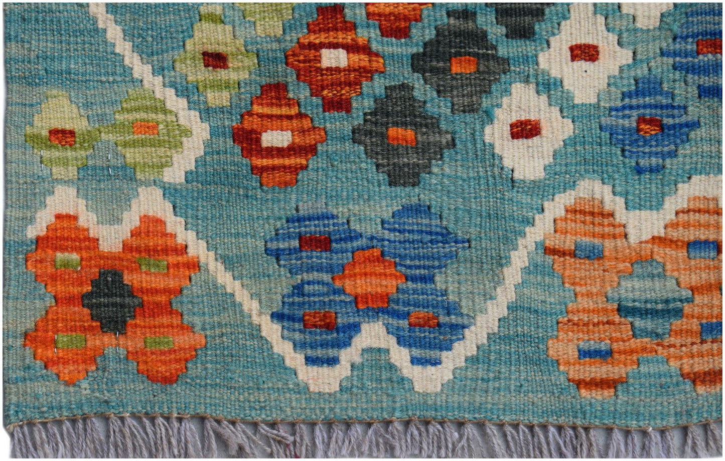Handwoven Afghan Maimana wool kilim runner featuring a geometric pattern in blue and orange tones.