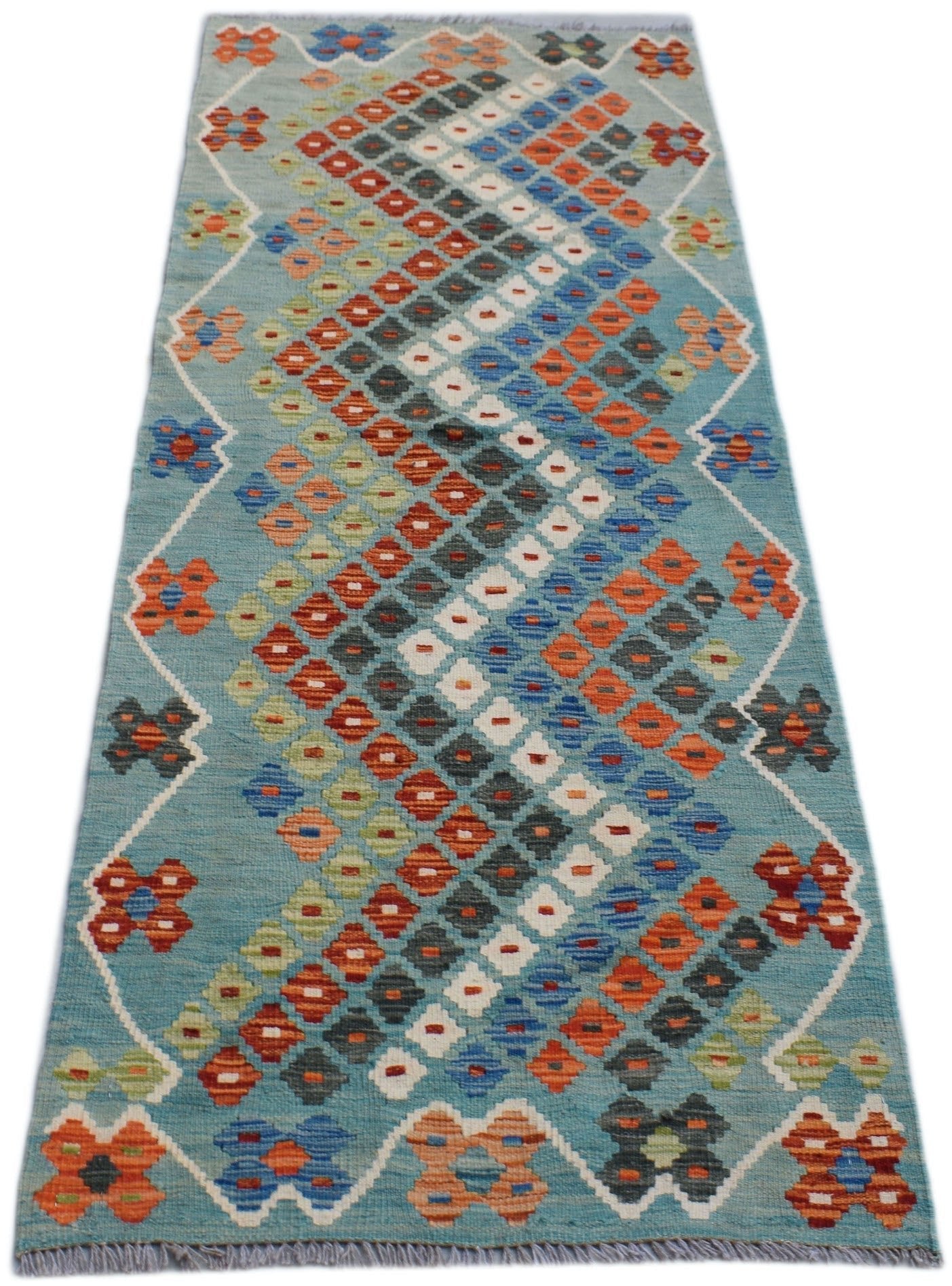 Handmade Afghan Maimana wool runner rug featuring a geometric diamond pattern in vibrant colors.