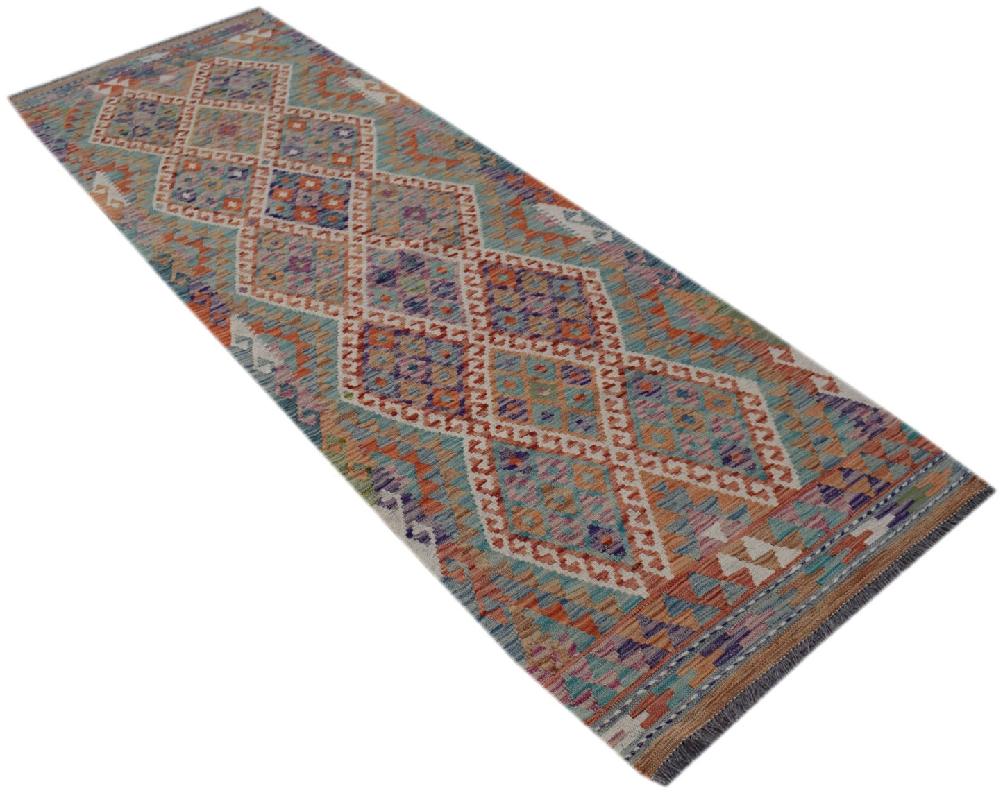 A handmade Afghan Maimana wool runner rug featuring a colorful geometric diamond pattern.