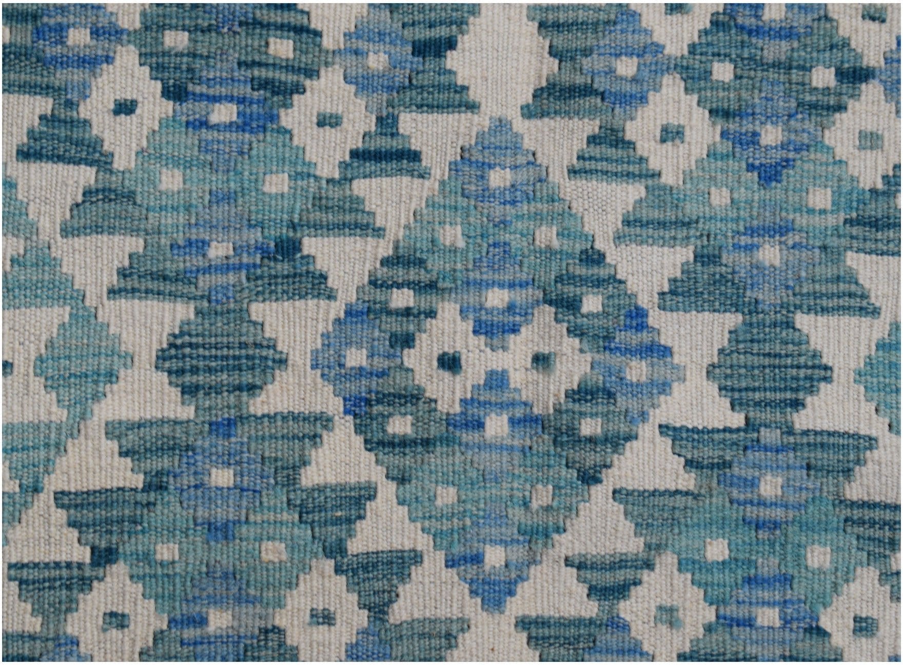 Handwoven Afghan Maimana kilim runner featuring a geometric diamond pattern in shades of blue.