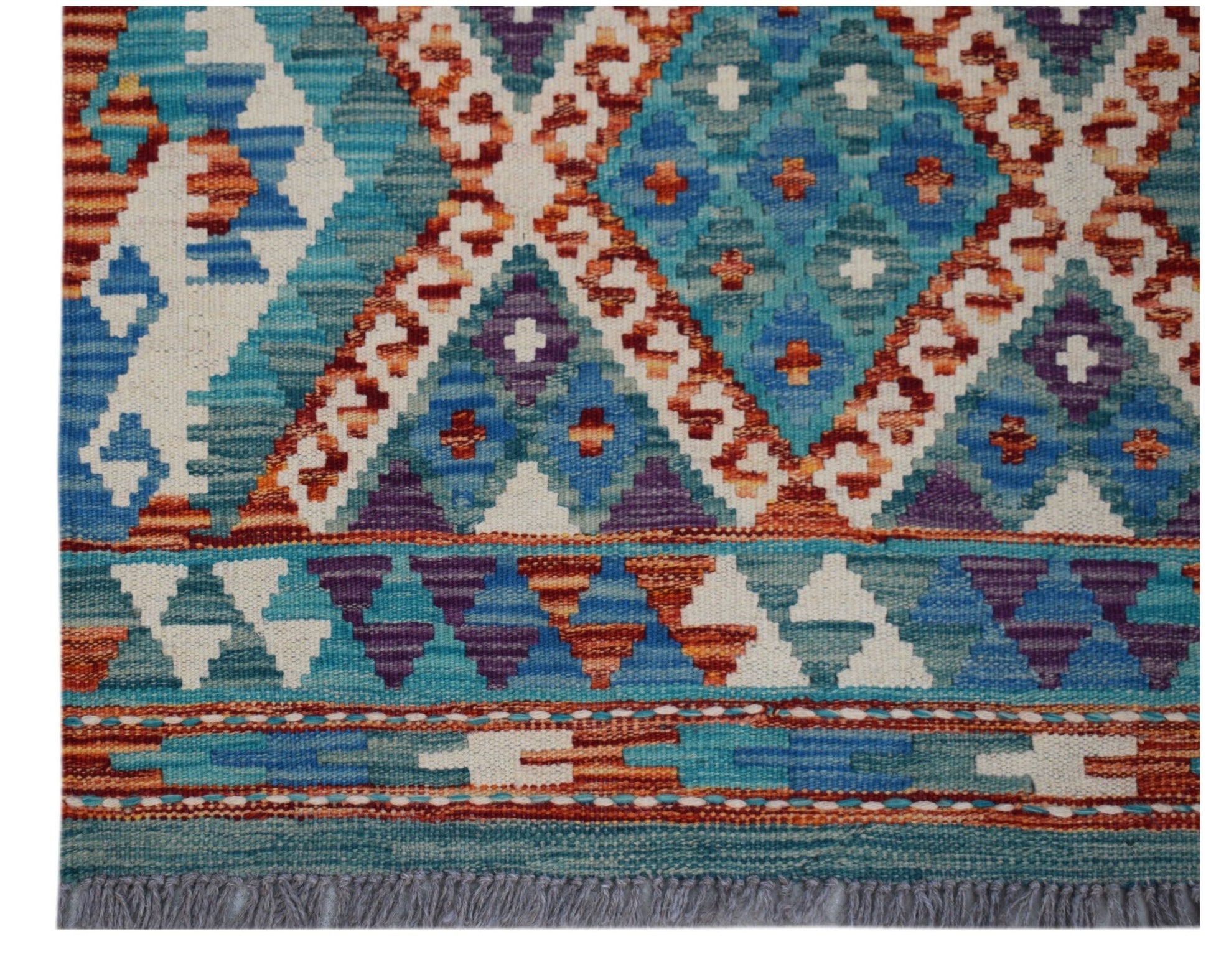 Handwoven Afghan Maimana wool runner featuring a geometric pattern in blue, orange, and purple.