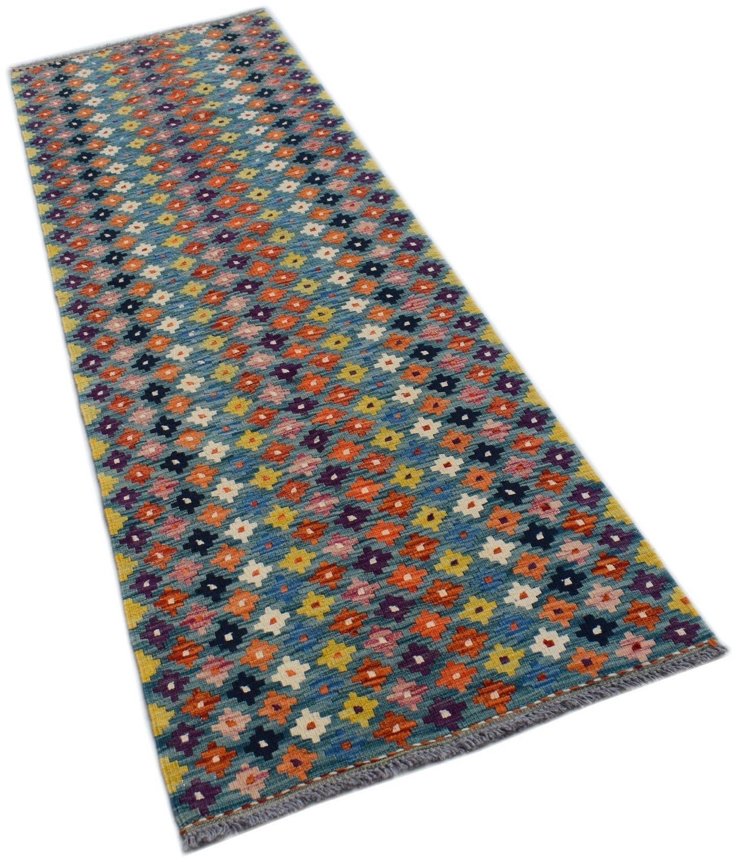 A handmade Afghan Maimana Kilim runner featuring a colorful geometric pattern on a blue background.