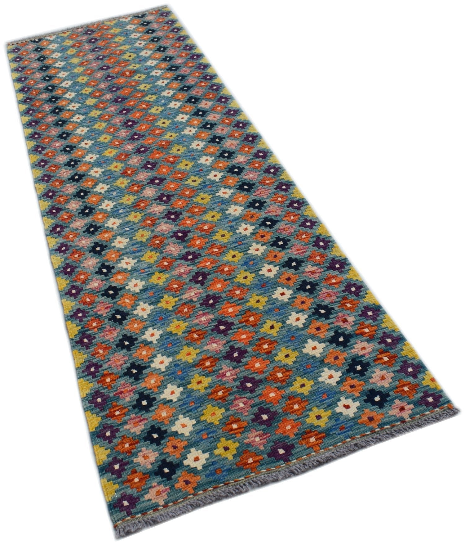 A handmade Afghan Maimana Kilim runner featuring a colorful geometric pattern on a blue background.
