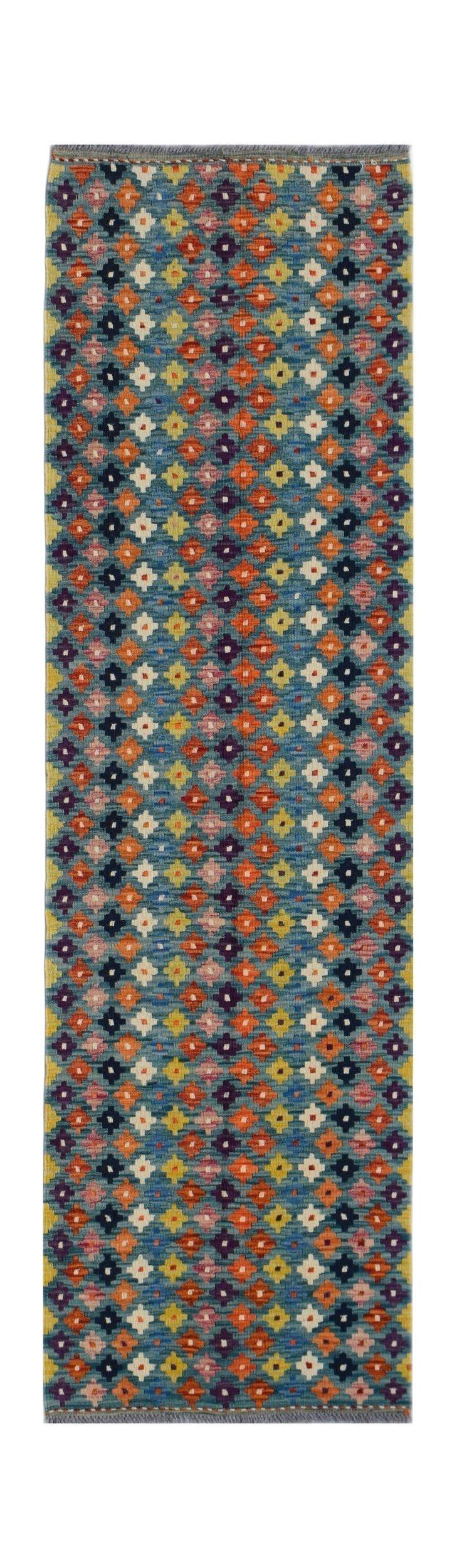 Handwoven Afghan Maimana wool runner featuring a colorful geometric pattern on a blue background.