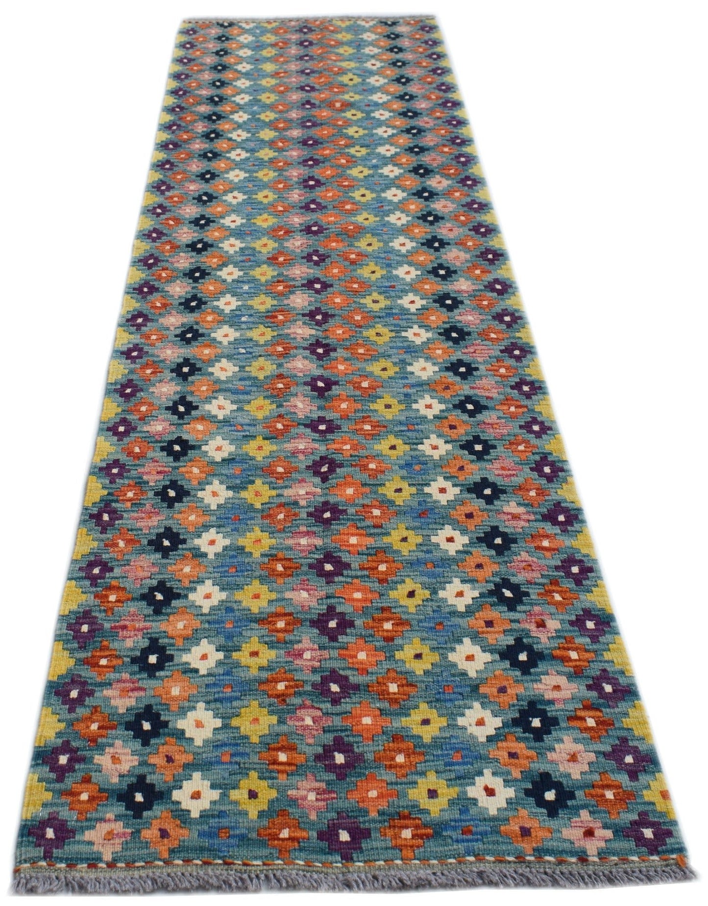 Handwoven Afghan Maimana wool runner featuring a colorful geometric pattern on a blue background.