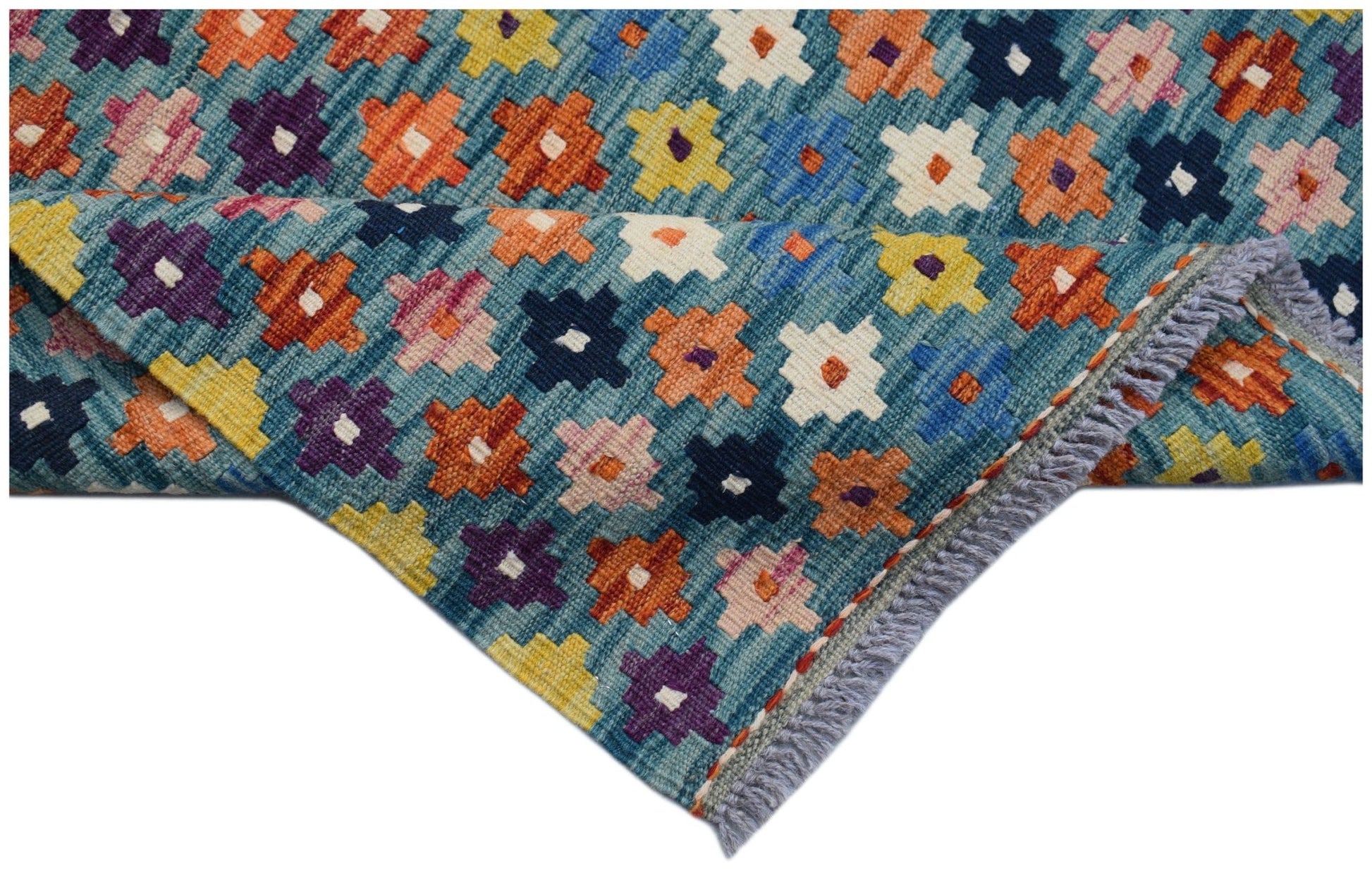 Handwoven Afghan Maimana kilim runner featuring a colorful geometric pattern on a blue background.