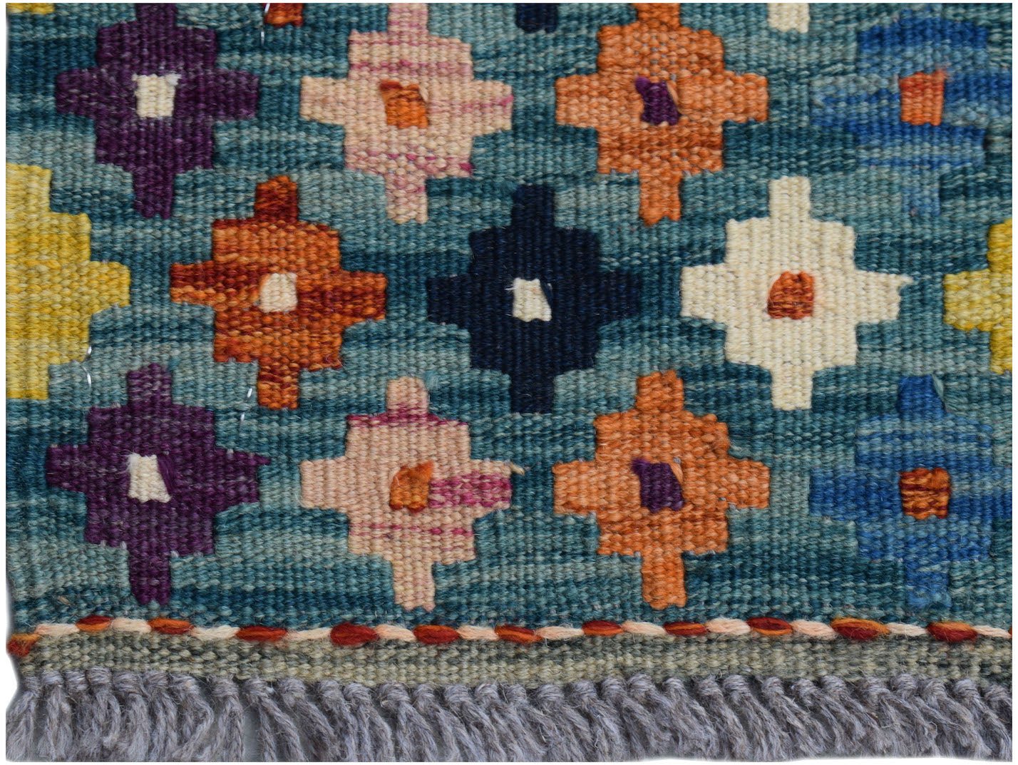 Handwoven Afghan Maimana kilim runner featuring a geometric pattern in vibrant multicolored hues.