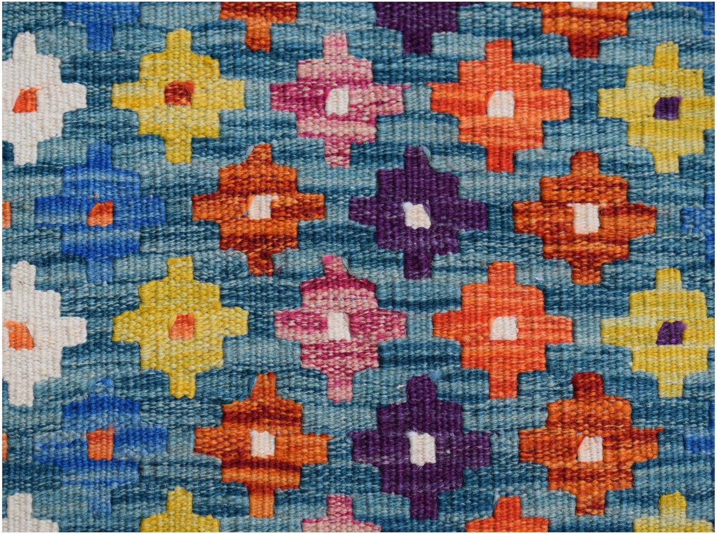 Handwoven Afghan Maimana kilim runner featuring a geometric pattern of colorful cross motifs.