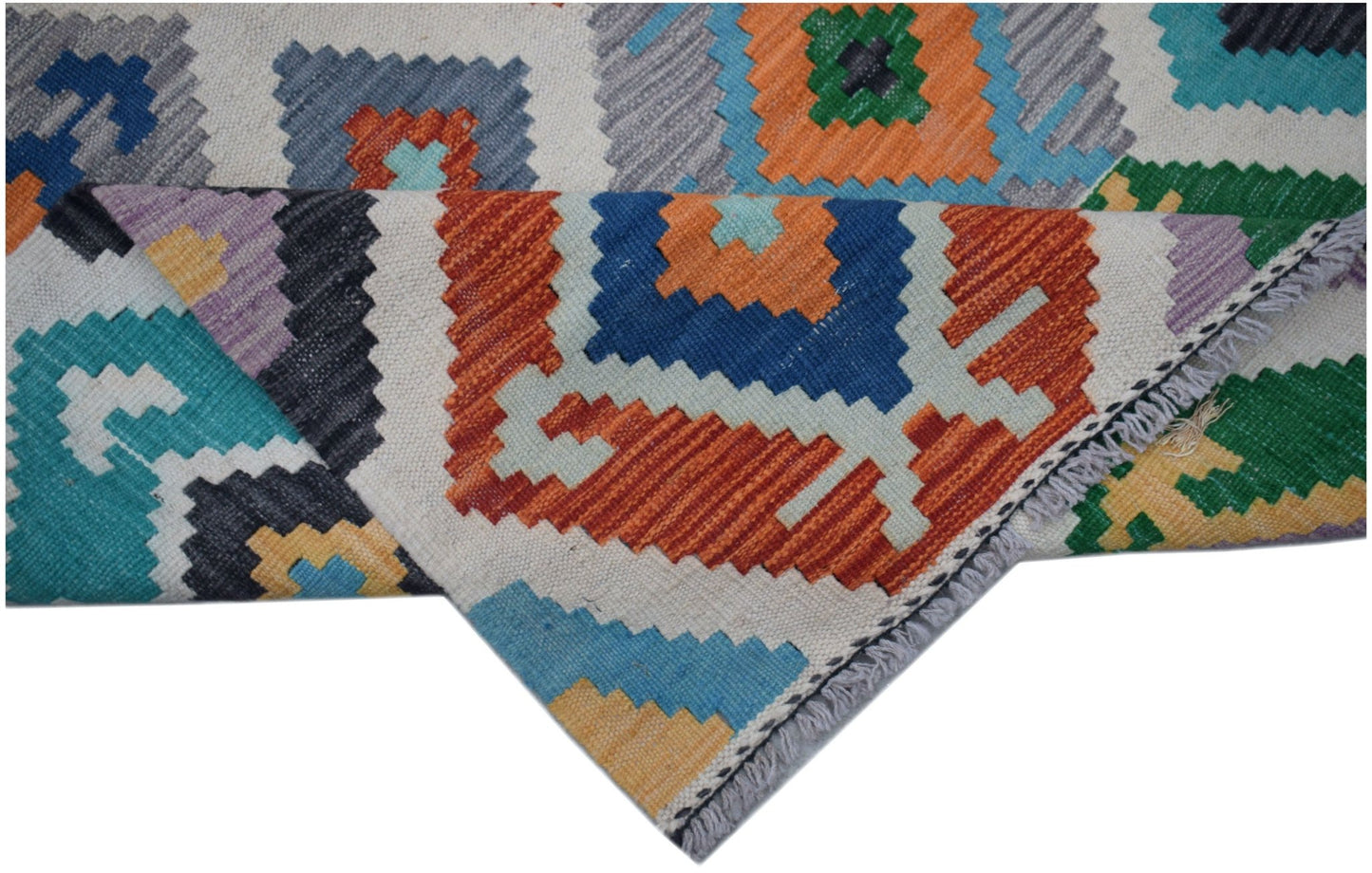 A handmade Afghan Maimana Kilim runner featuring a vibrant geometric pattern in wool.