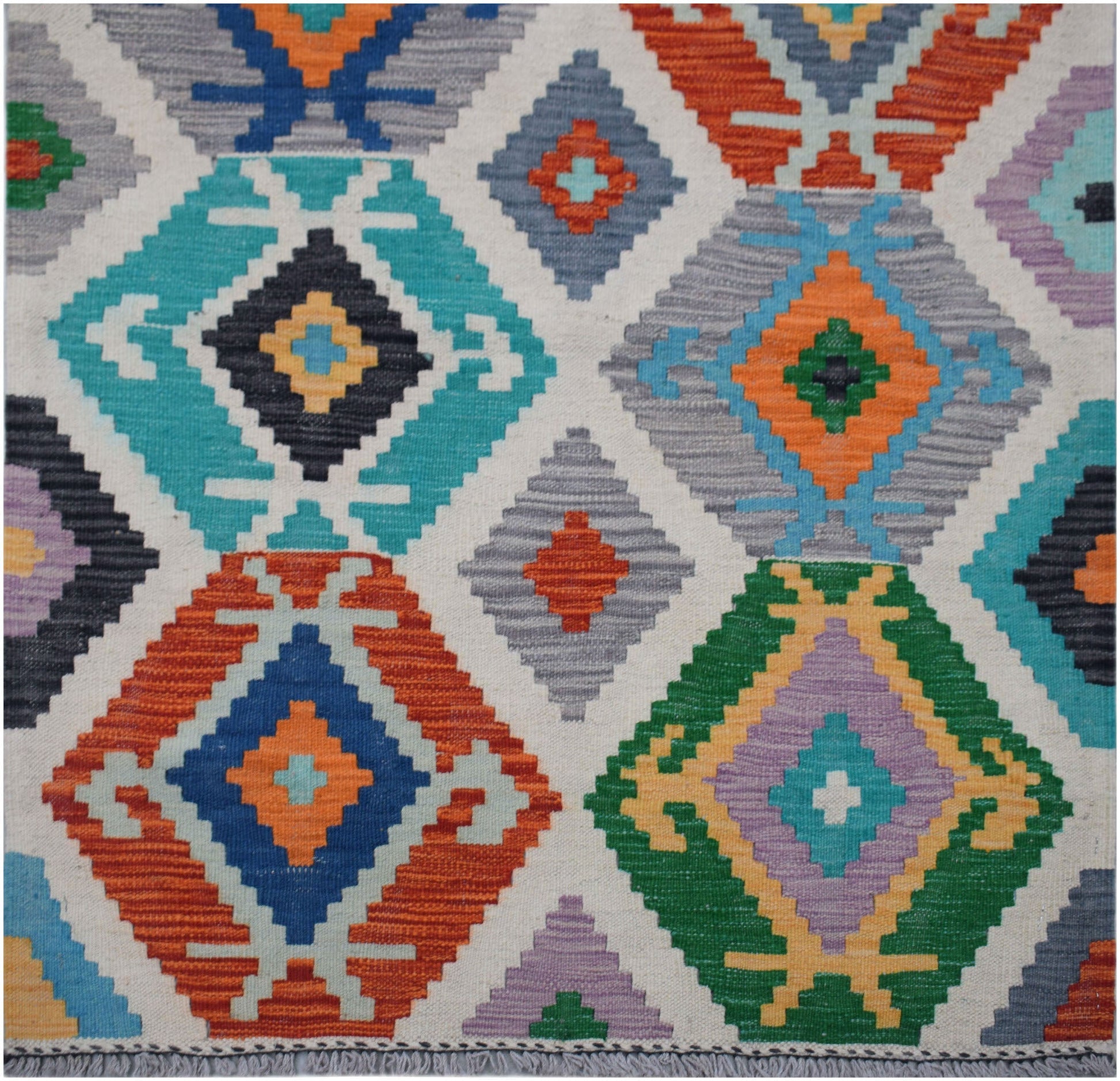 Handwoven Afghan Maimana wool kilim runner featuring a colorful geometric diamond pattern.