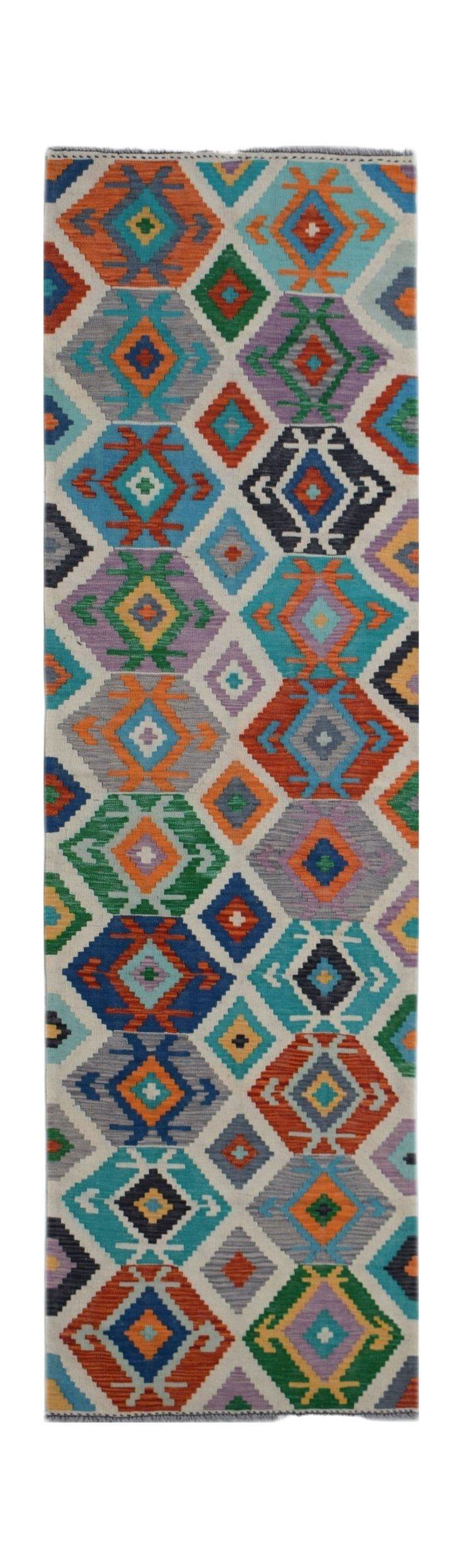Handwoven Afghan Maimana wool runner featuring a colorful geometric diamond pattern.