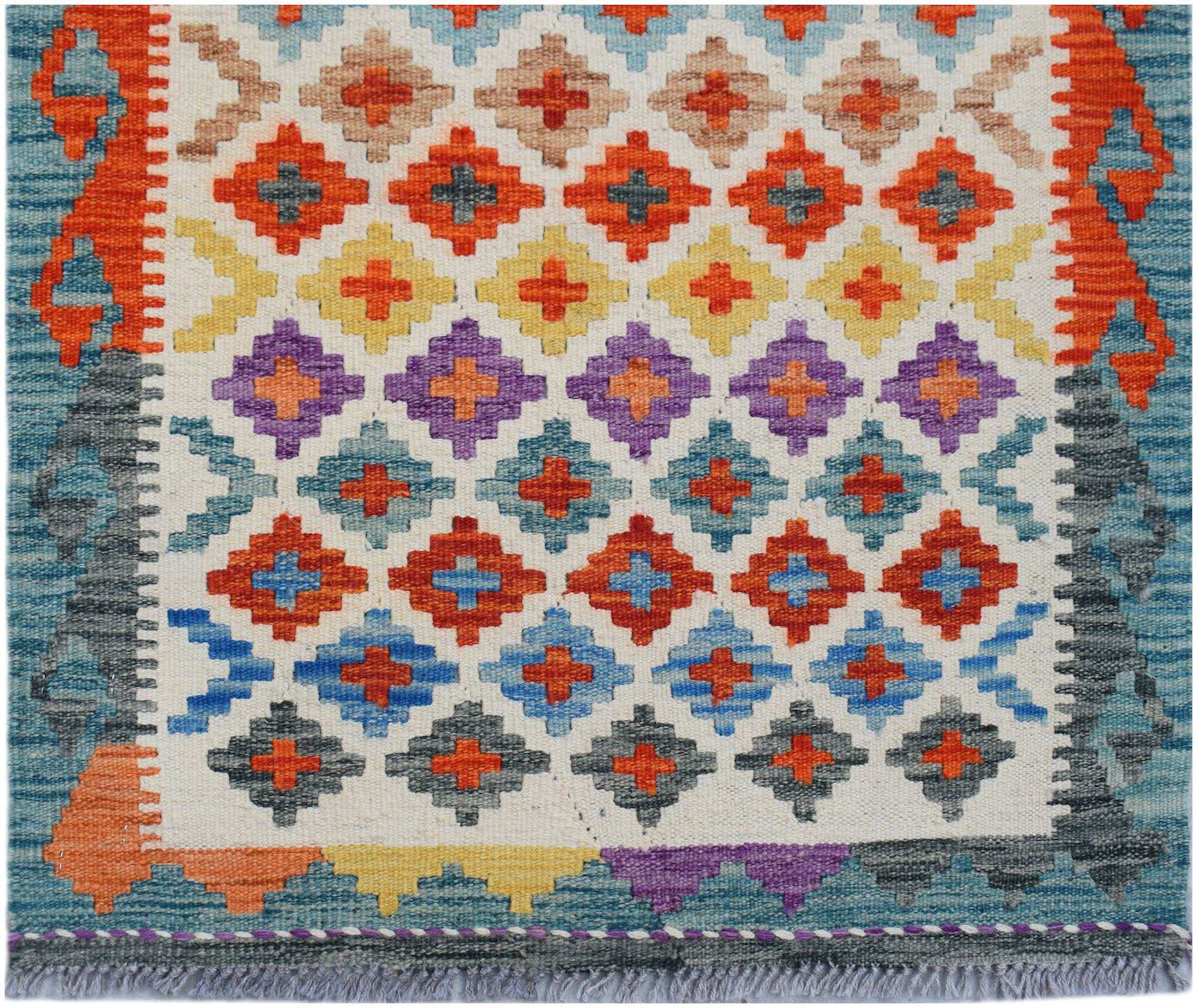 Handwoven Afghan Maimana wool runner featuring a colorful geometric pattern on a cream background.