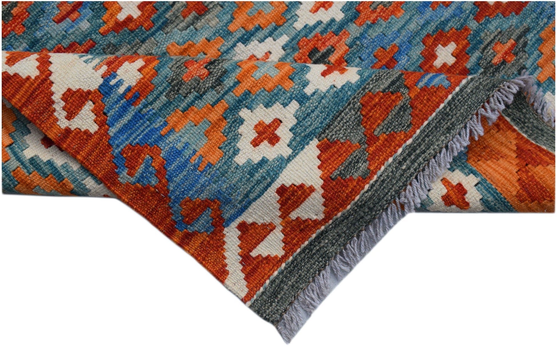 Handwoven Afghan Maimana wool runner featuring a geometric pattern in orange, blue, and cream.