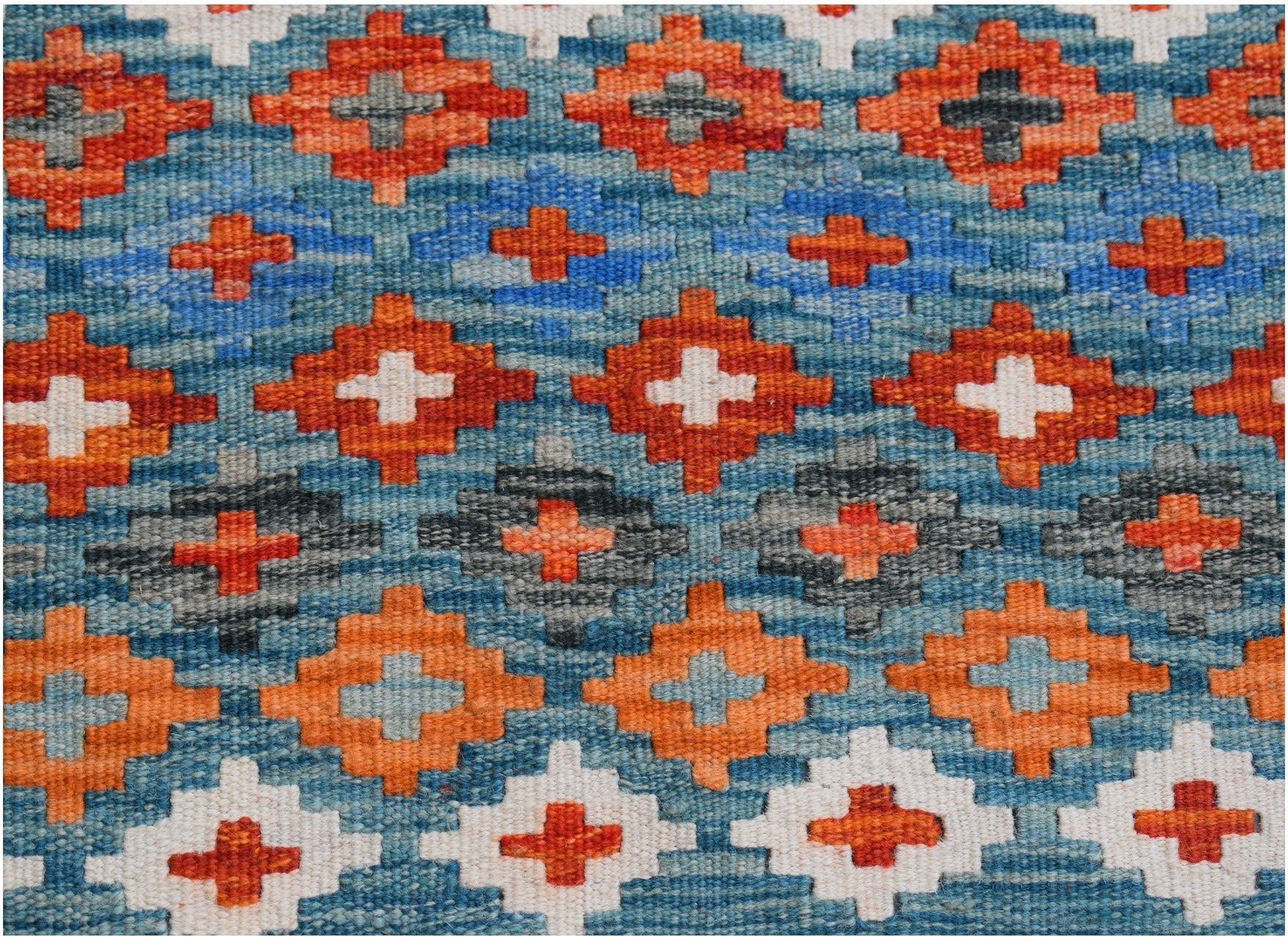 Handwoven Afghan Maimana kilim runner featuring a geometric pattern of orange, blue, and white.