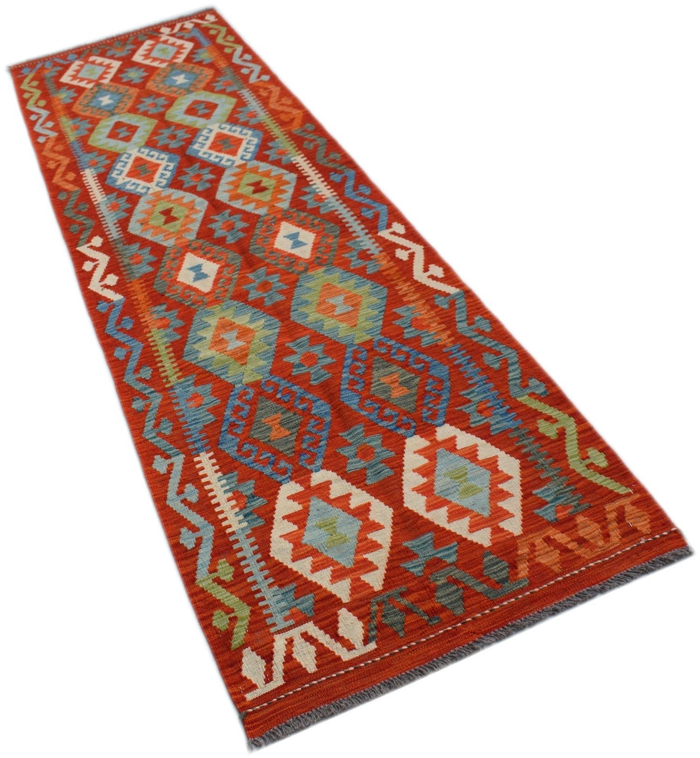 A handmade Afghan Maimana wool runner rug featuring a vibrant geometric pattern in red and blue.