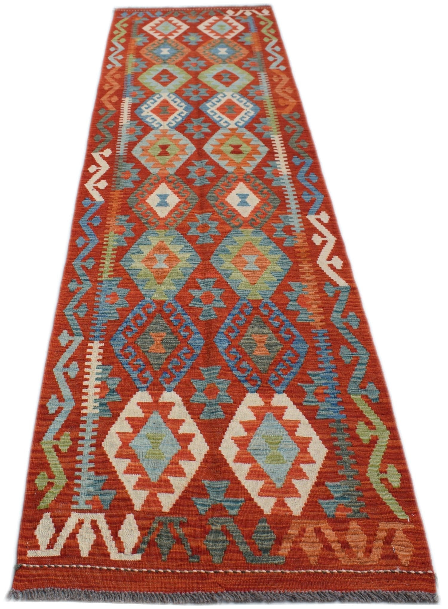Handwoven Afghan Maimana wool runner rug featuring a vibrant red background with geometric patterns.