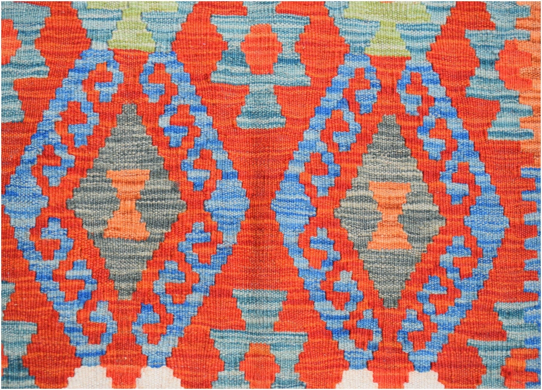 Handwoven Afghan Maimana kilim runner featuring a geometric diamond pattern in red, blue, and grey.