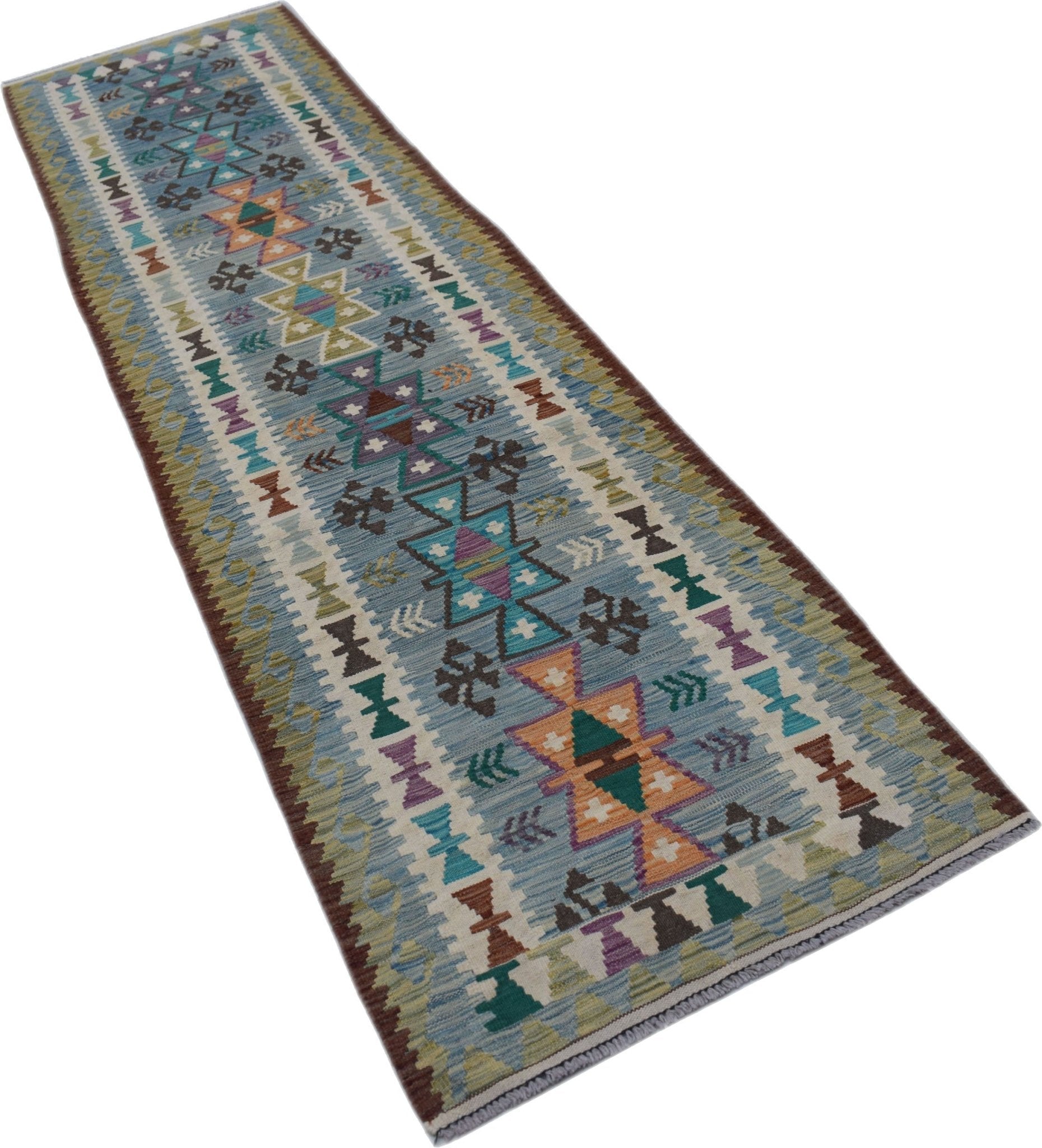 A handmade Afghan Maimana wool runner rug featuring a colorful geometric pattern on a blue field.